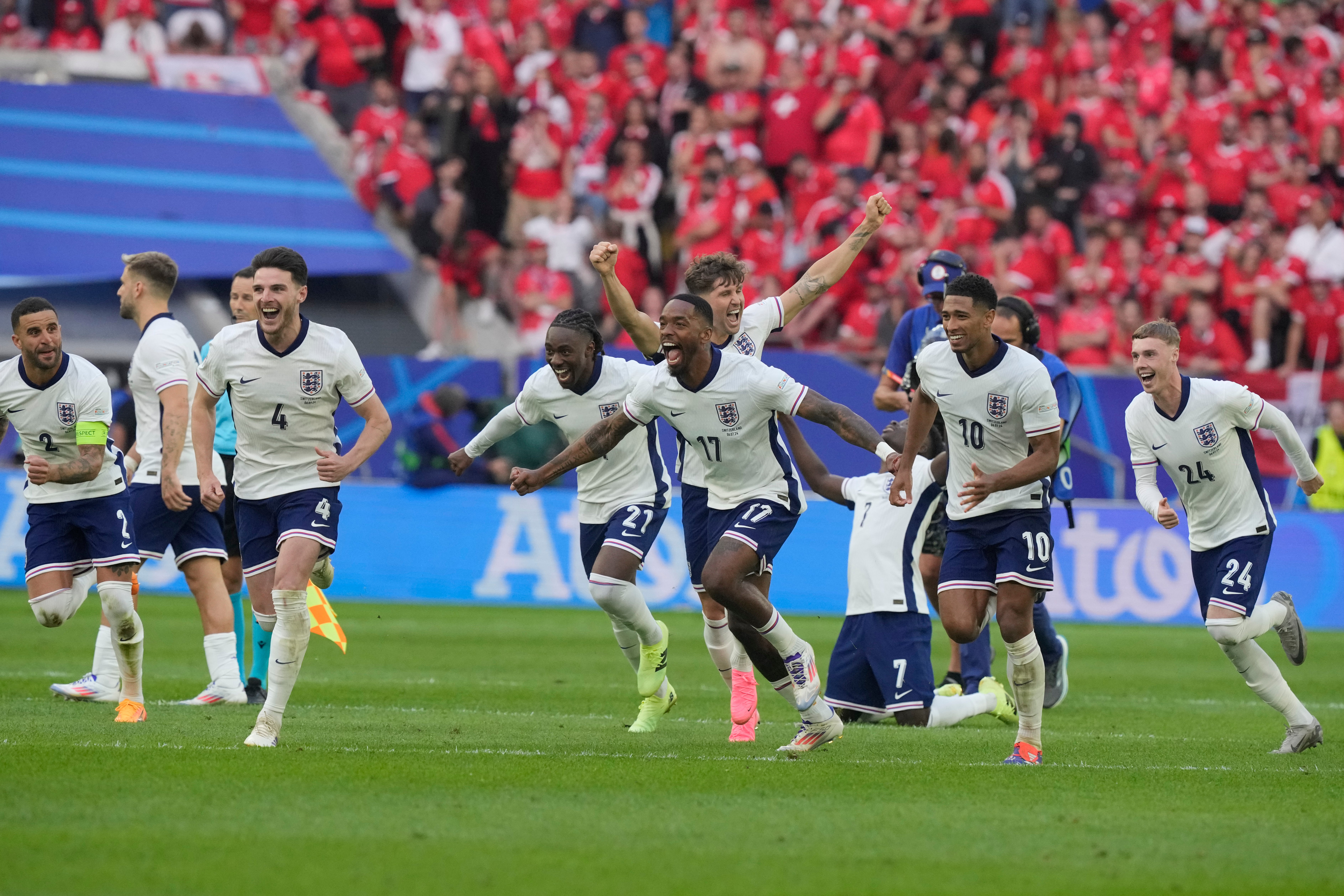 England players rush to celebrate their shootout victory