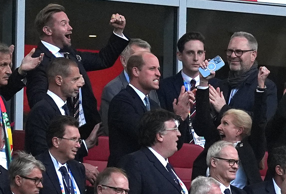 The Prince of Wales (centre) celebrates England winning the penalty shoot-out (Martin Rickett/PA)