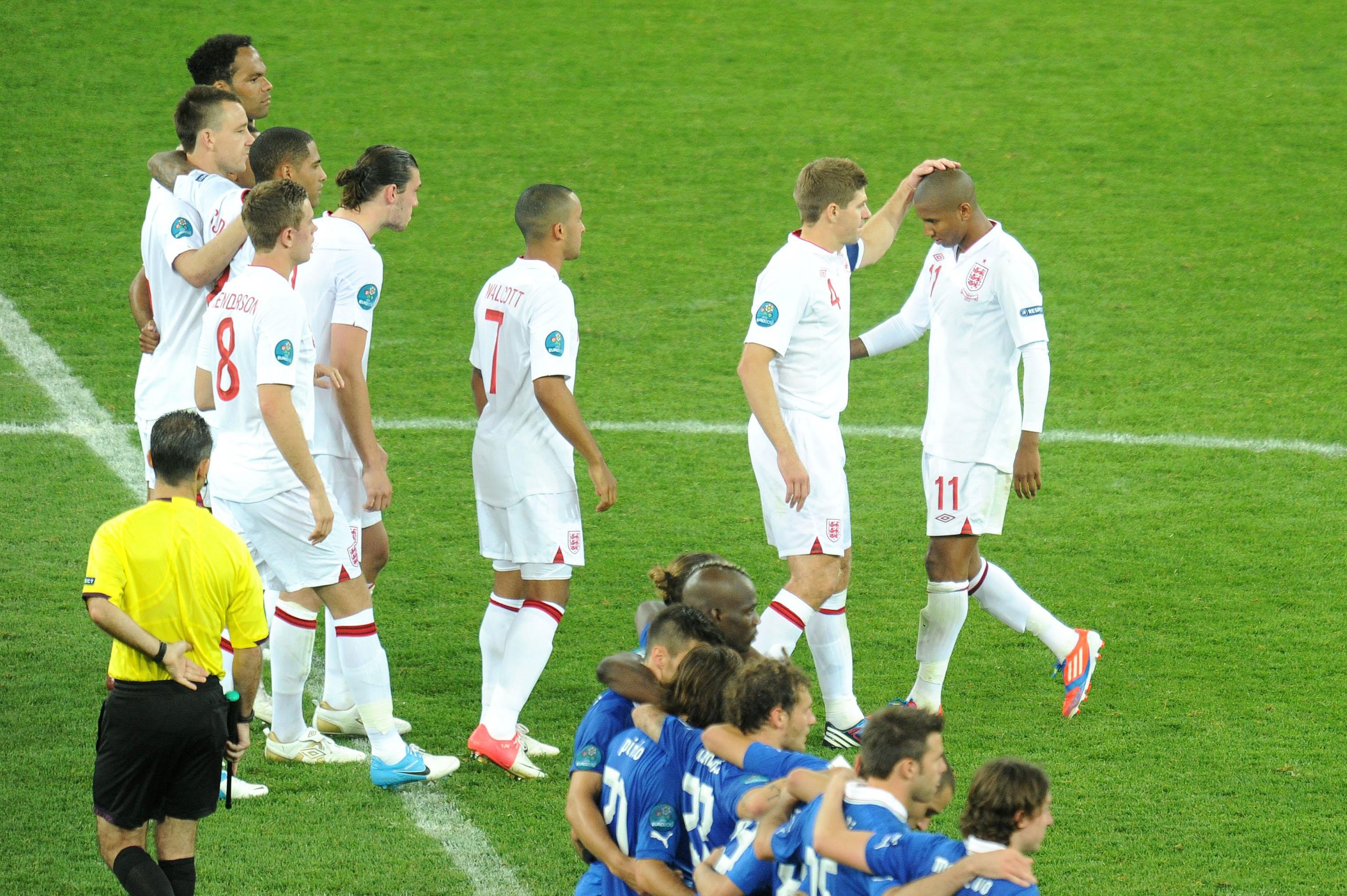 Steven Gerrard consoles Ashley Young after missing his penalty (Owen Humphreys/PA)