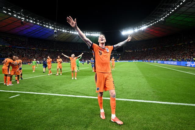 <p>Wout Weghorst celebrates after Netherlands won their quarter-final</p>