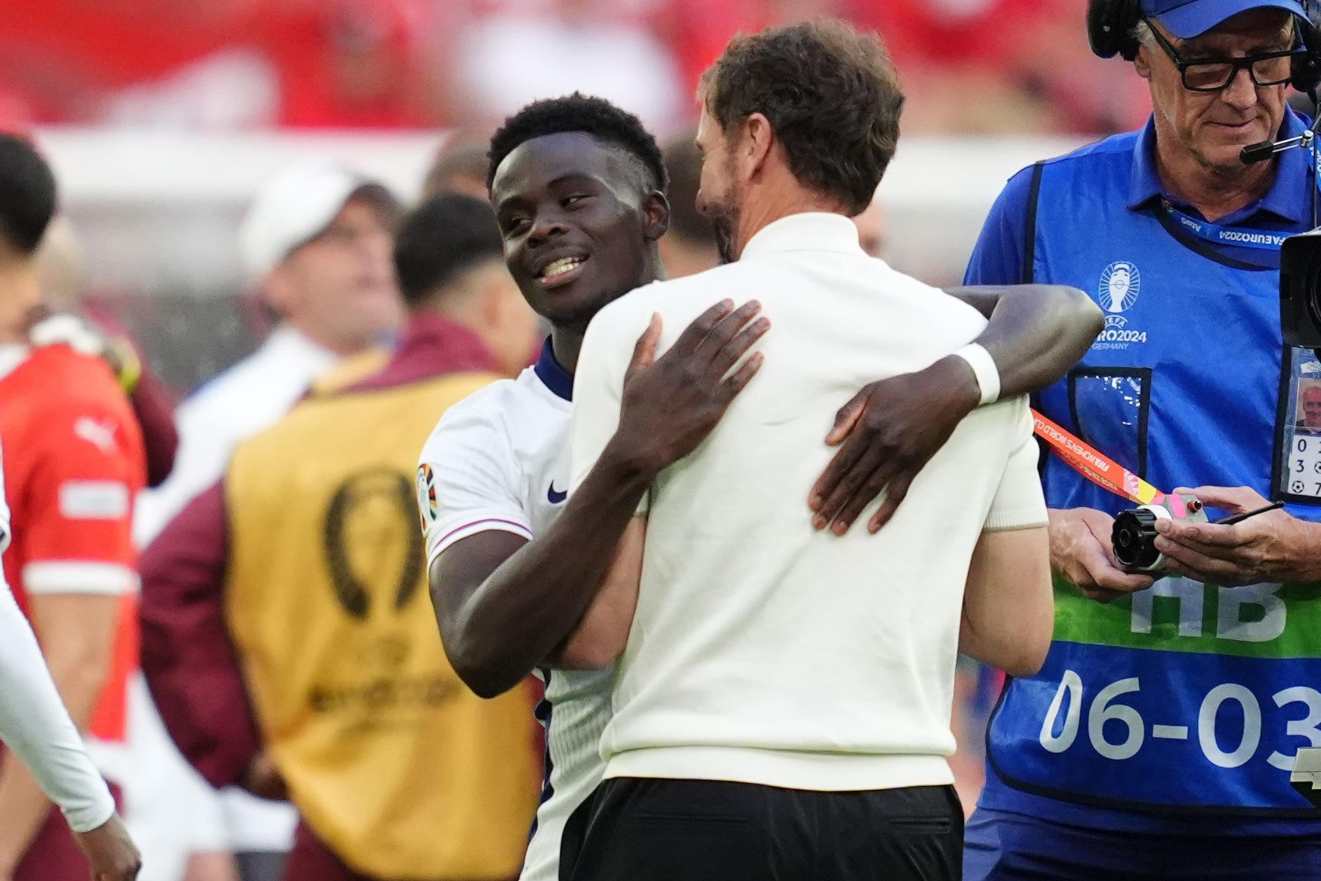 England manager Gareth Southgate and Bukayo Saka celebrate after victory over Switzerland (Adam Davy/PA)