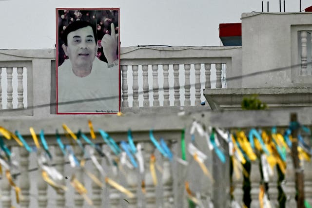 <p>Hindu preacher Suraj Pal’s portrait is displayed at his ashram in Mainpuri, Uttar Pradesh, on 4 July 2024</p>