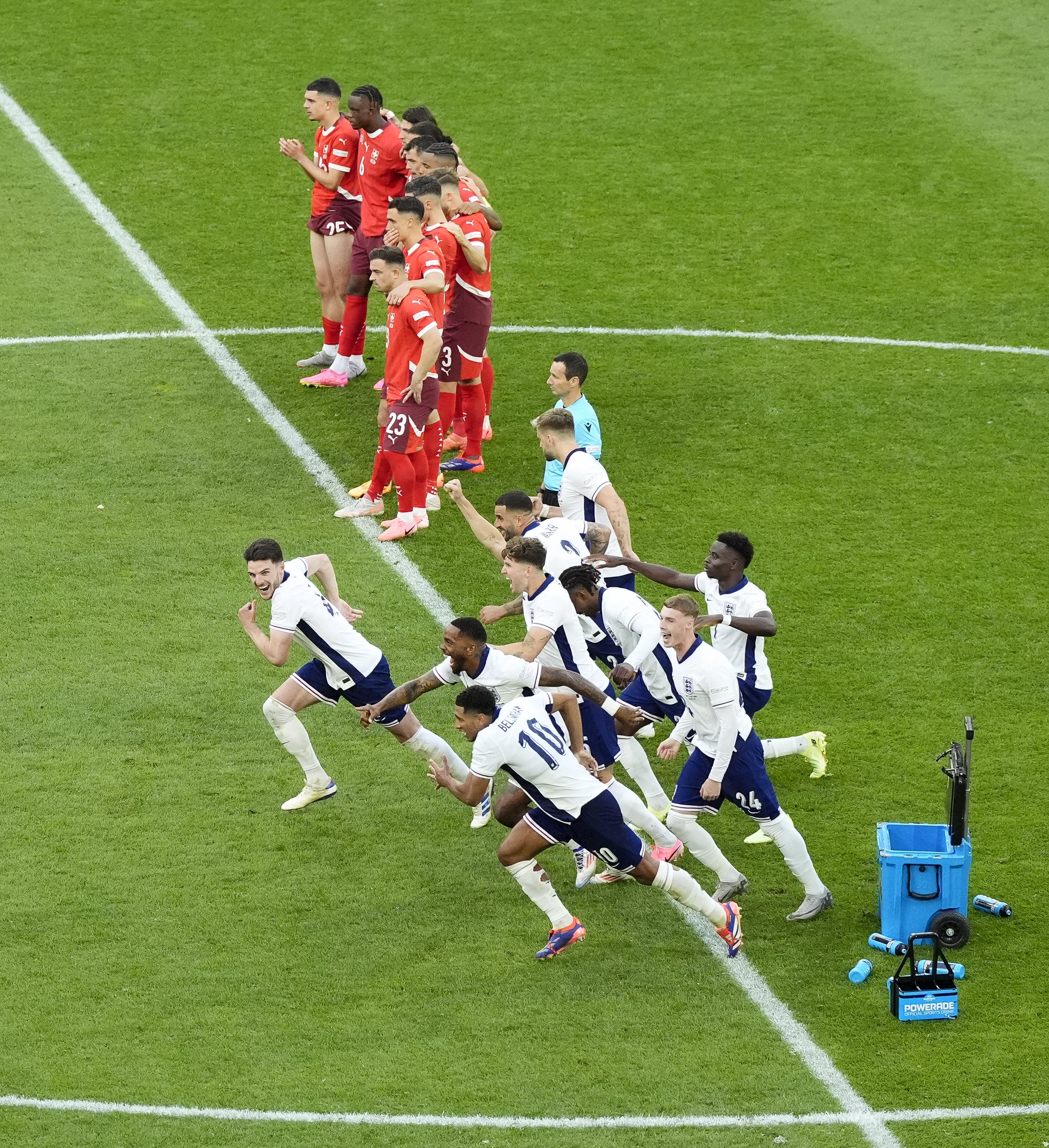England players celebrate after Trent Alexander-Arnold scores the winning penalty against Switzerland (Nick Potts/PA)