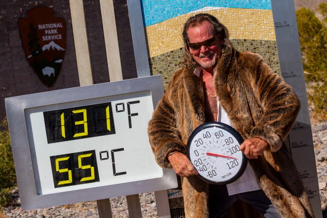 <p>Thor Teigen poses in a fur jacket next to a thermometer displaying a temperature of 131 degrees Fahrenheit / 55 degrees Celsius at the Furnace Creek Visitors Center, in Death Valley National Park </p>