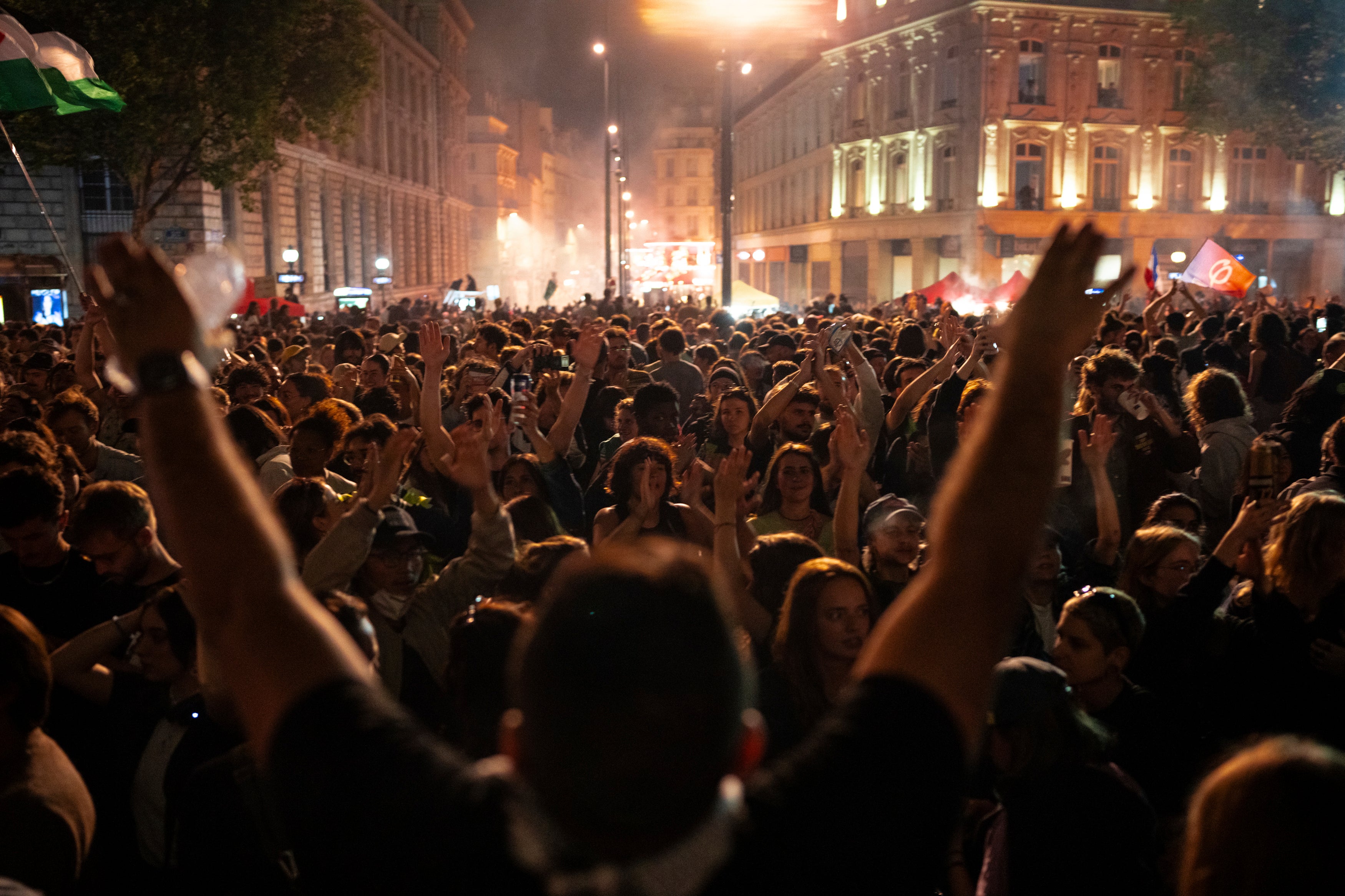 People gather at the Republique plaza in Paris after the second round of the legislative election on Sunday