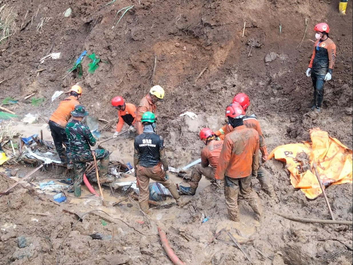 Rescue workers search for victims of the landslide in Gorontalo province of Indonesia on 7 July 2024