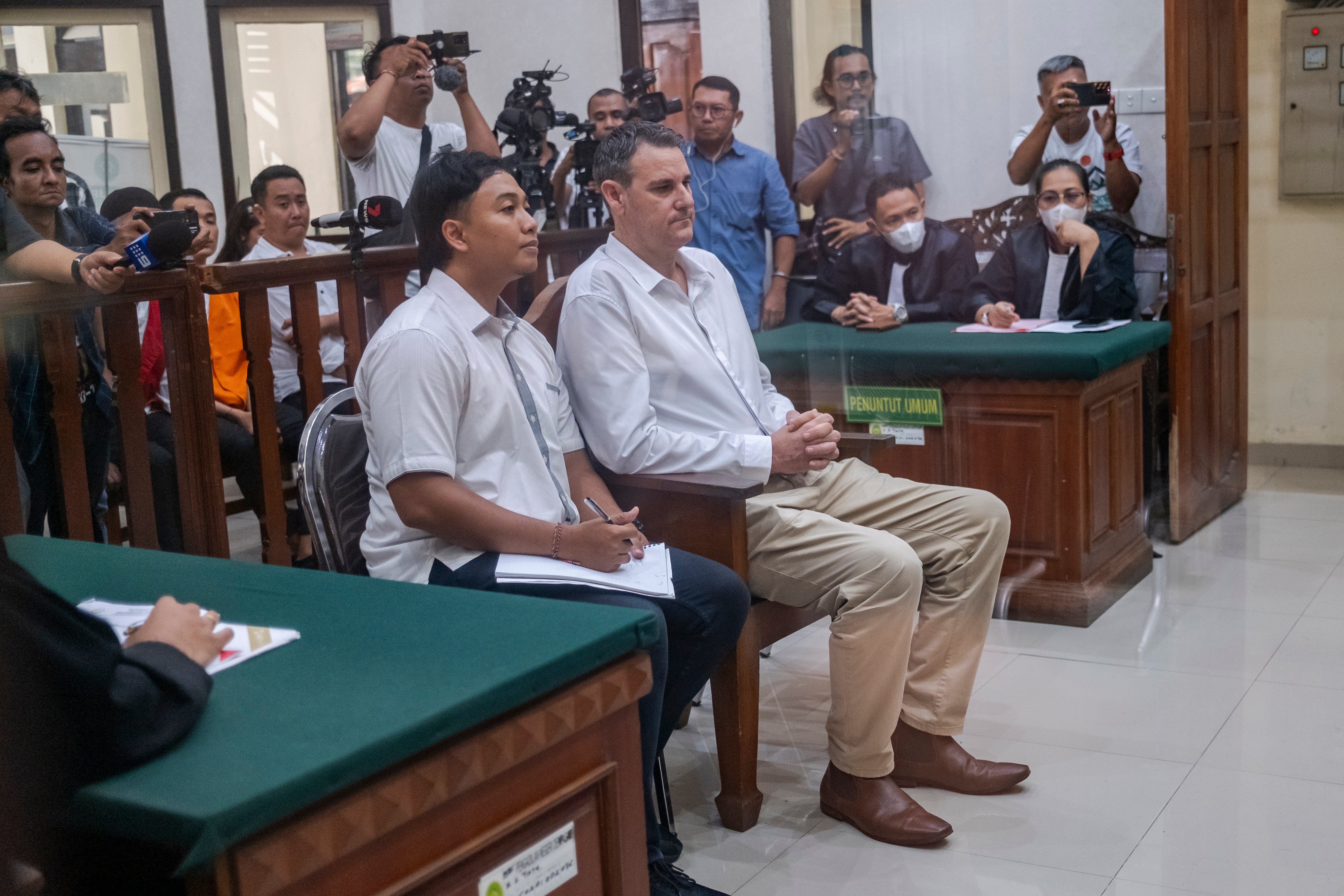 Troy Smith (R) of Australia sits in a courtroom waiting for the announcement of his verdict in a trial at the Denpasar district court, in Denpasar, Bali, Indonesia, 04 July 2024.