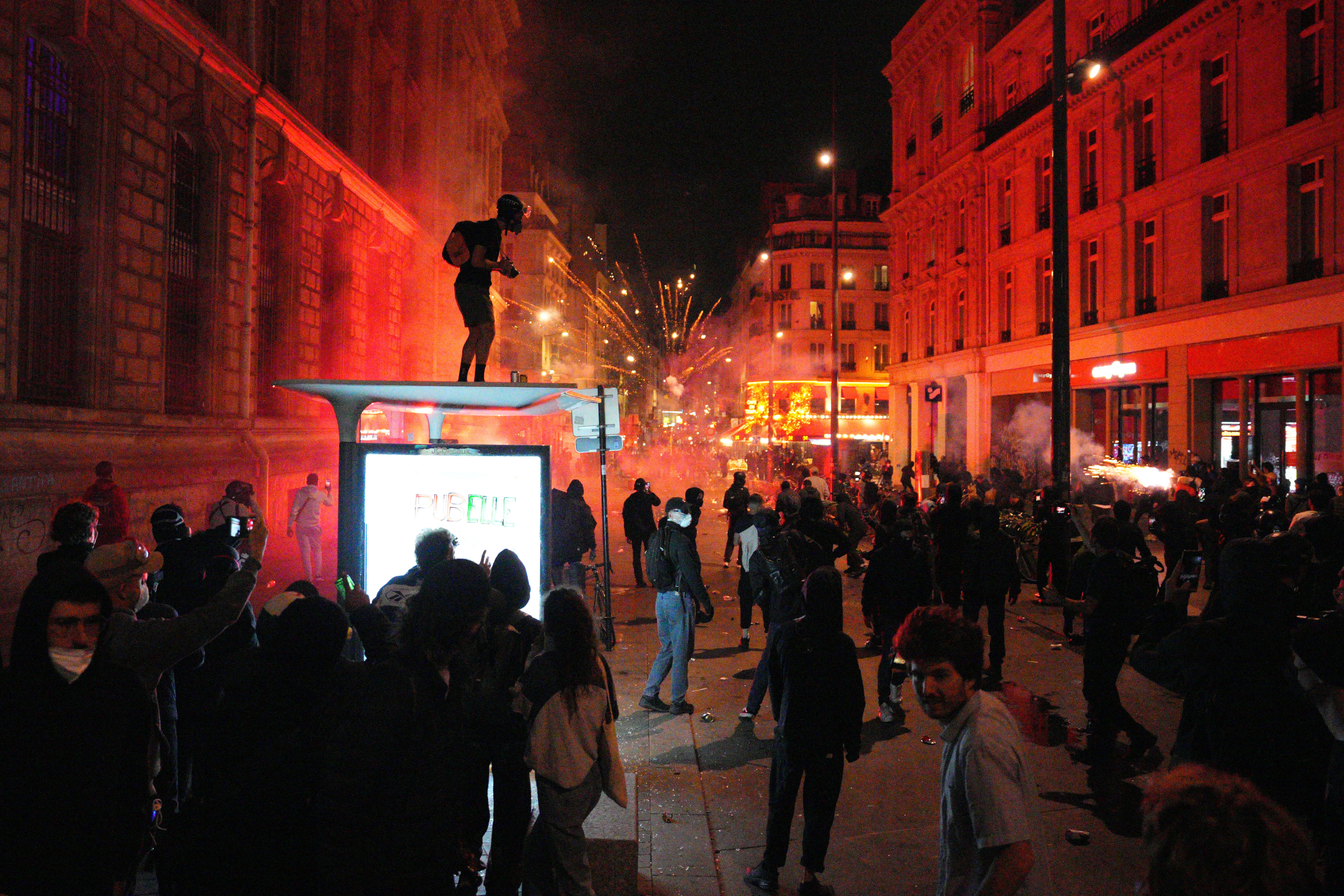 Protesters clash with police in Paris after news broke of shock exit polls result