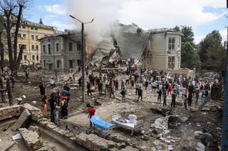 Rescuers scour the rubble of Ohmatdyt Children’s Hospital that was damaged in a Russian attack