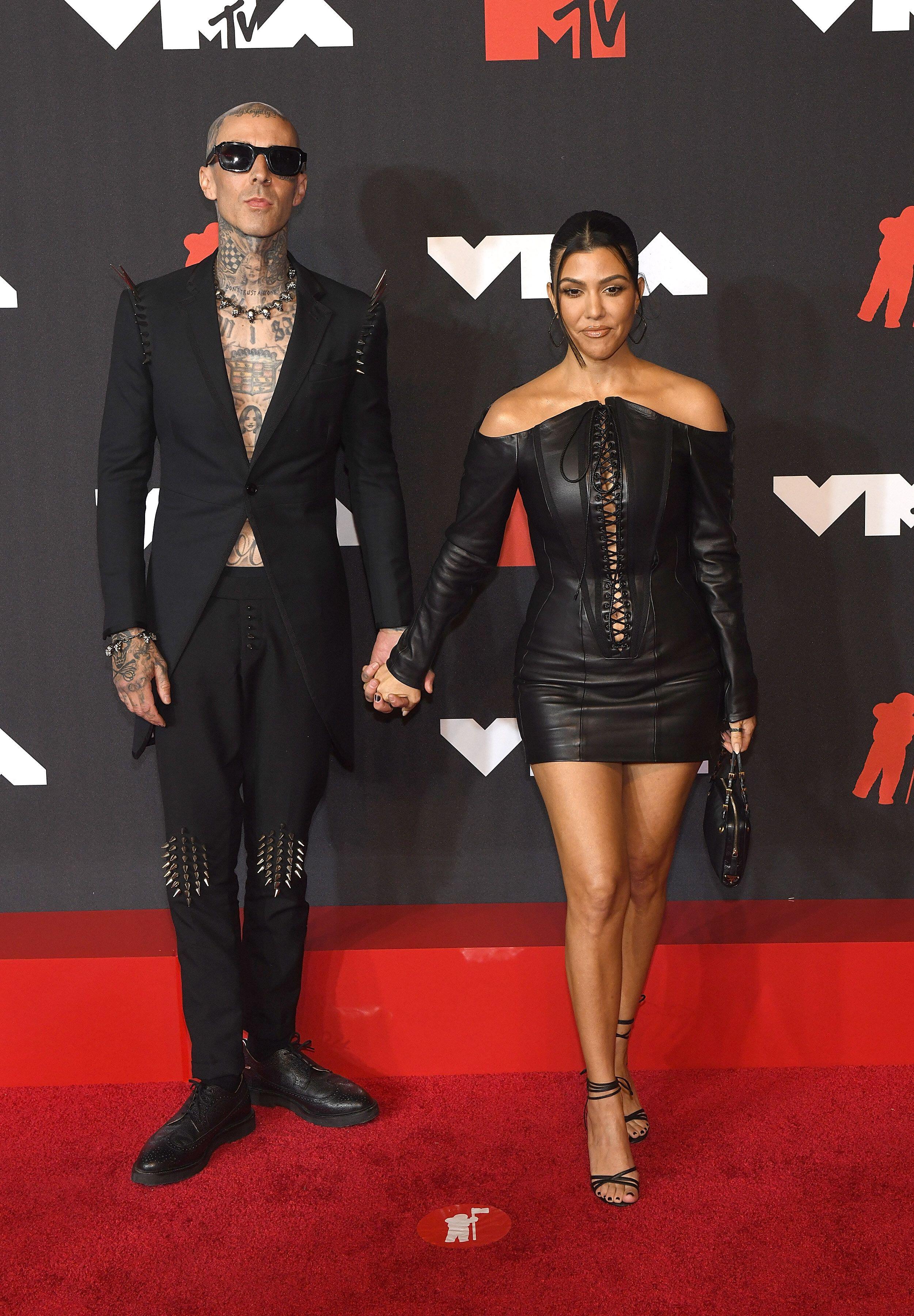 Travis Barker and Kourtney Kardashian have become synonymous with couple dressing (Alamy/PA)