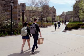 Students cross the campus of Boston College, Massachusetts