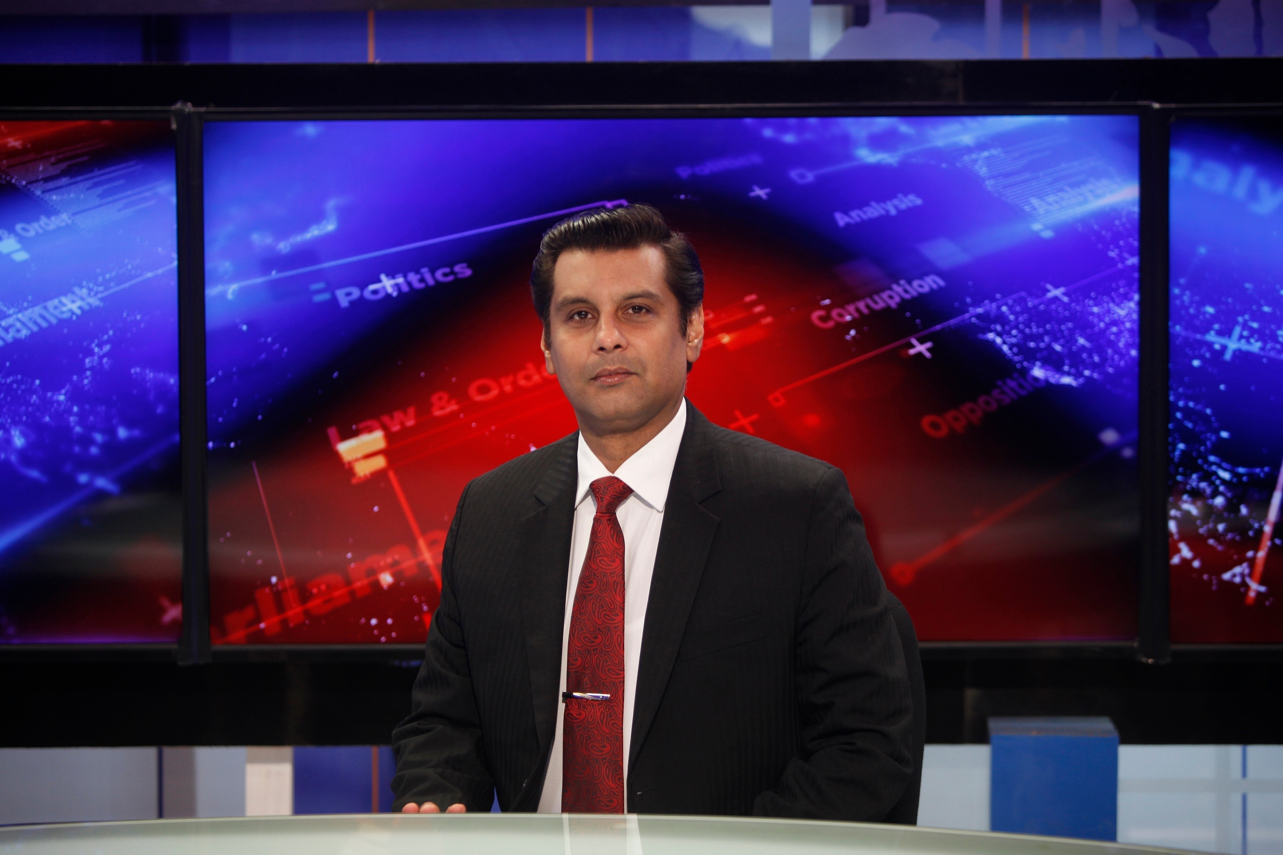 Senior Pakistani journalist Arshad Sharif poses for a photograph prior to recording an episode of his talk show at a studio in Islamabad, Pakistan
