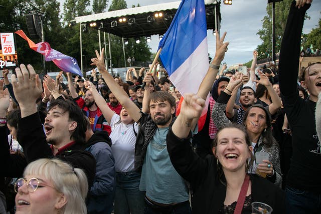<p>A crowd in Paris reacts to the results of the second round of the election</p>