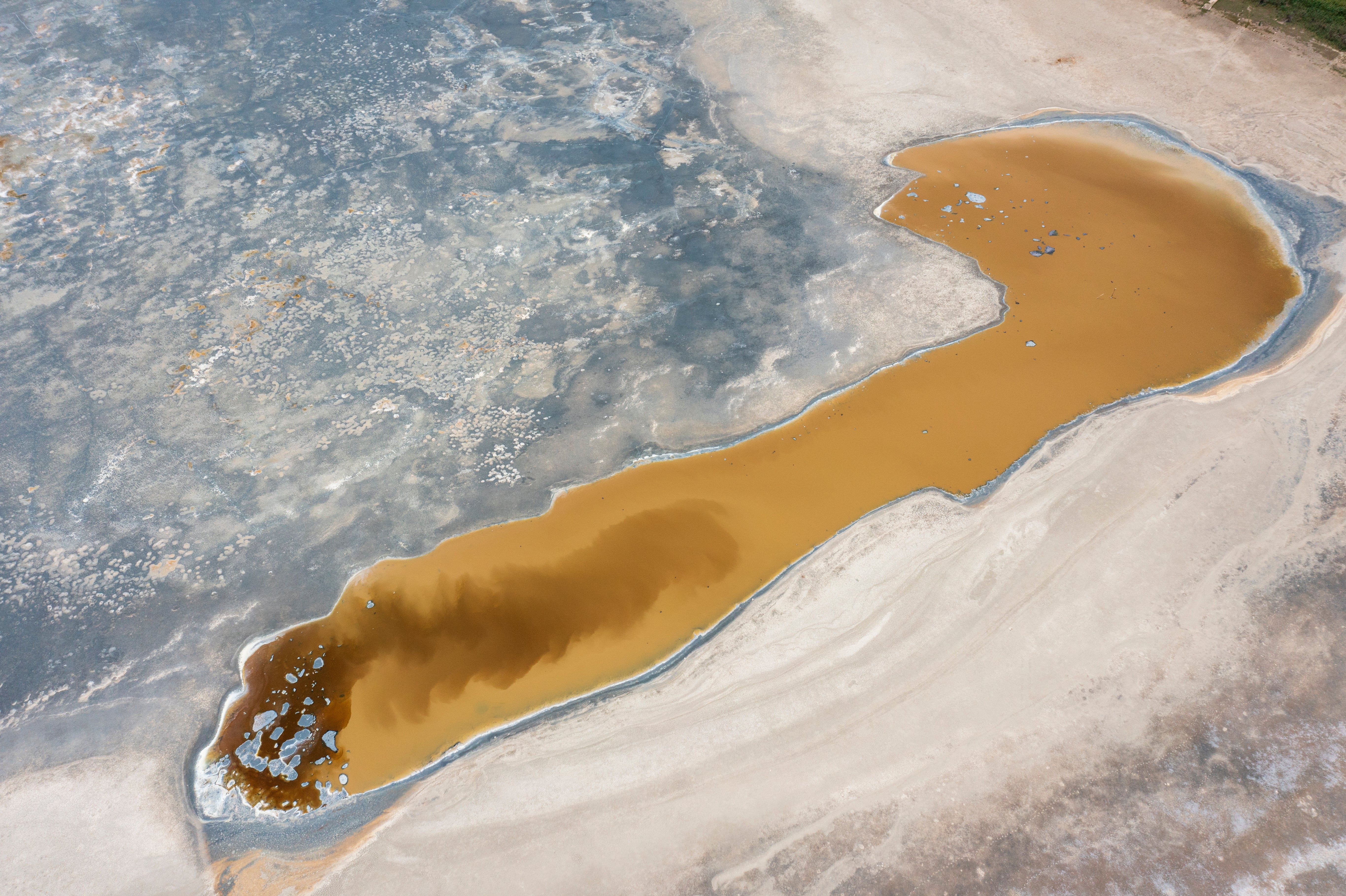 A detail of Lake Pergusa, Sicily’s only natural lake, now almost dried up and reduced to a pool of mud on June 28, 2024 in Enna, Italy