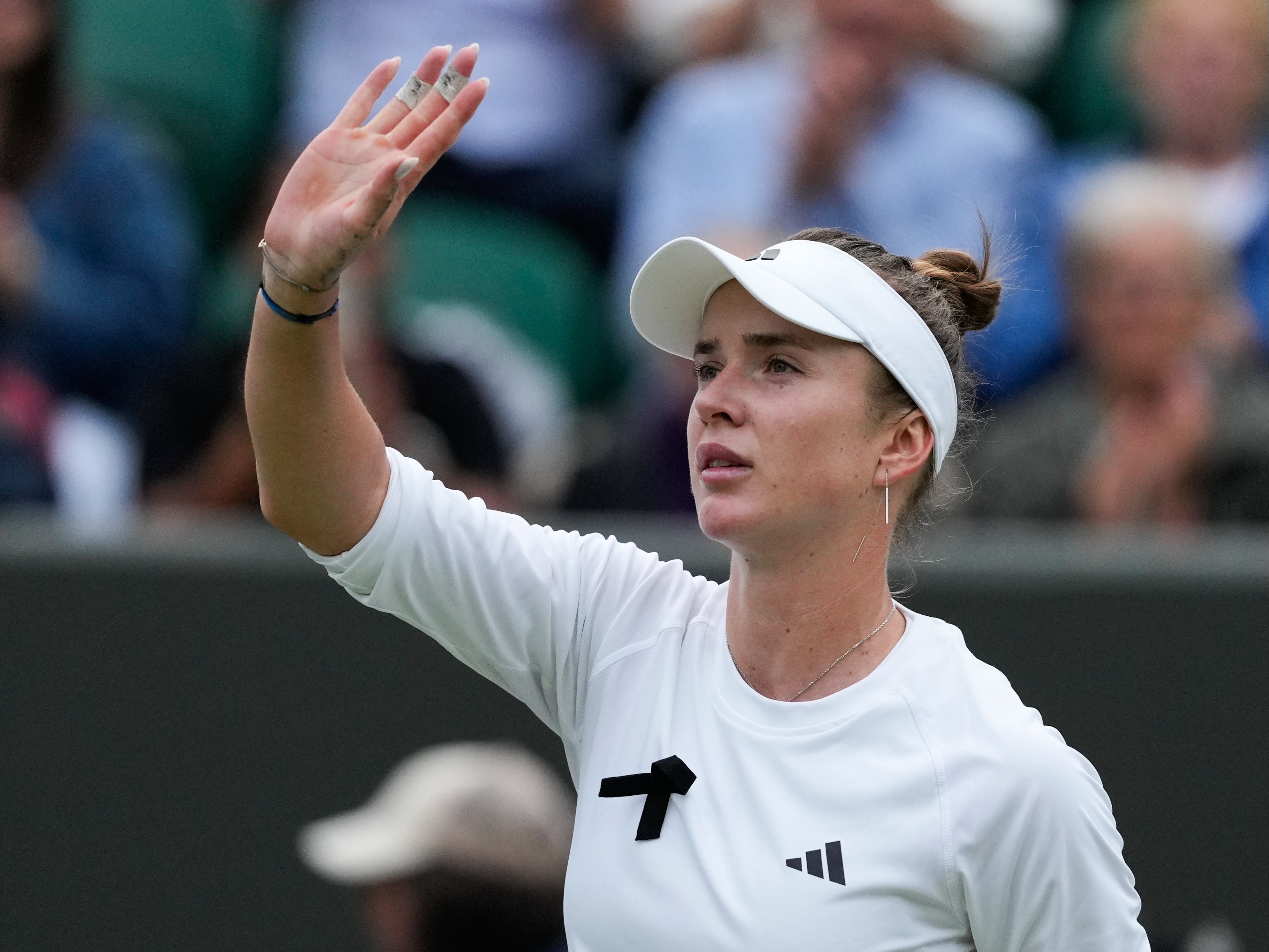 Elina Svitolina of Ukraine waves after defeating Xinyu Wang of China