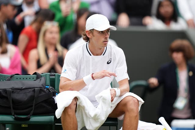 Alex de Minaur looked concerned at the end of his fourth-round win over Arthur Fils at Wimbledon (Zac Goodwin/PA)