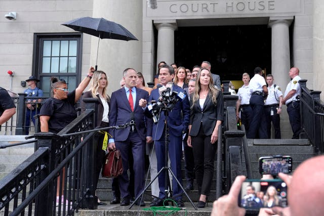 <p>Defense attorneys David Yannetti, center left, and Alan Jackson, center, speak to reporters as Karen Read, center right, looks on in front of Norfolk Superior Court, Monday, July 1, 2024</p>
