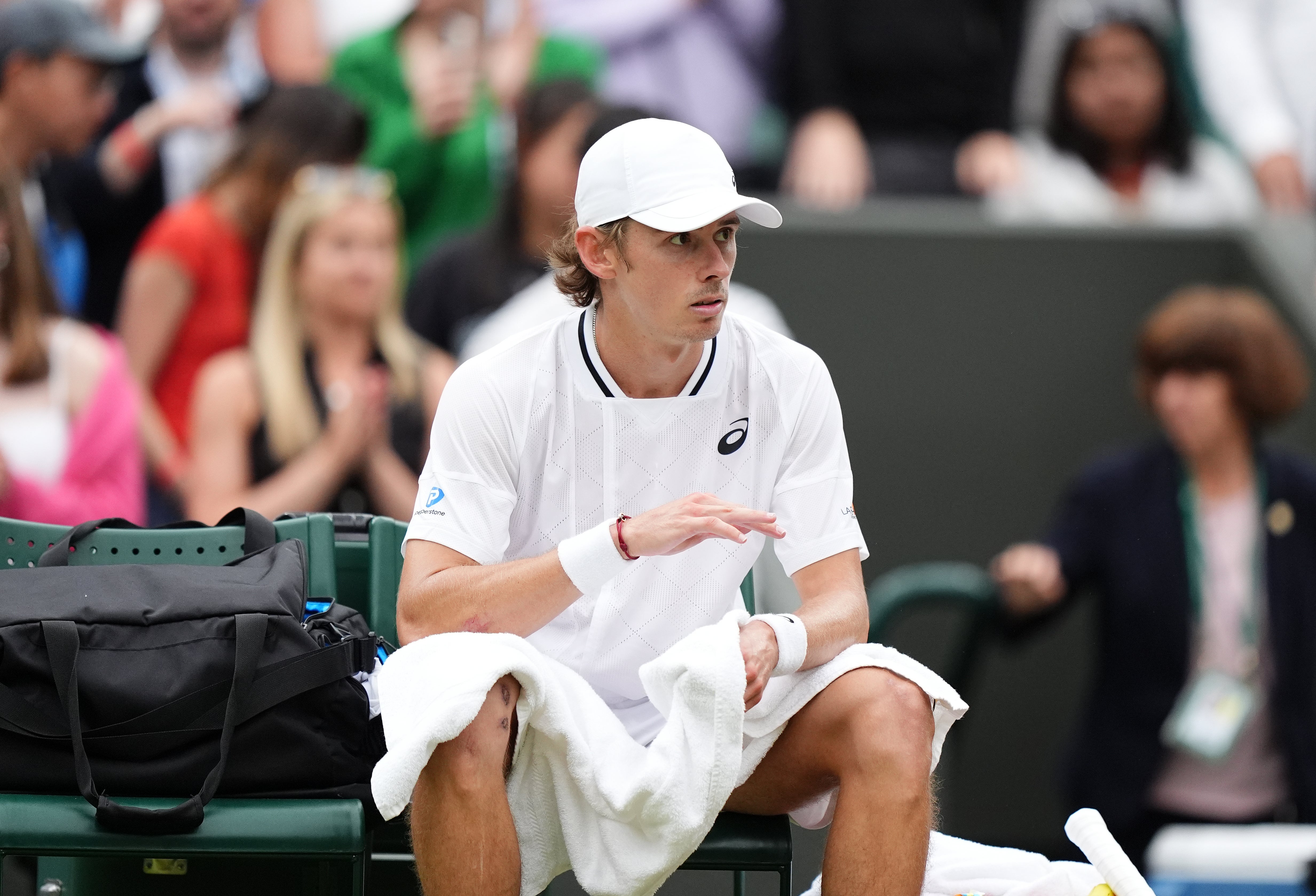 Alex De Minaur appeared in pain after clinching his quarter-final spot (Zac Goodwin/PA)