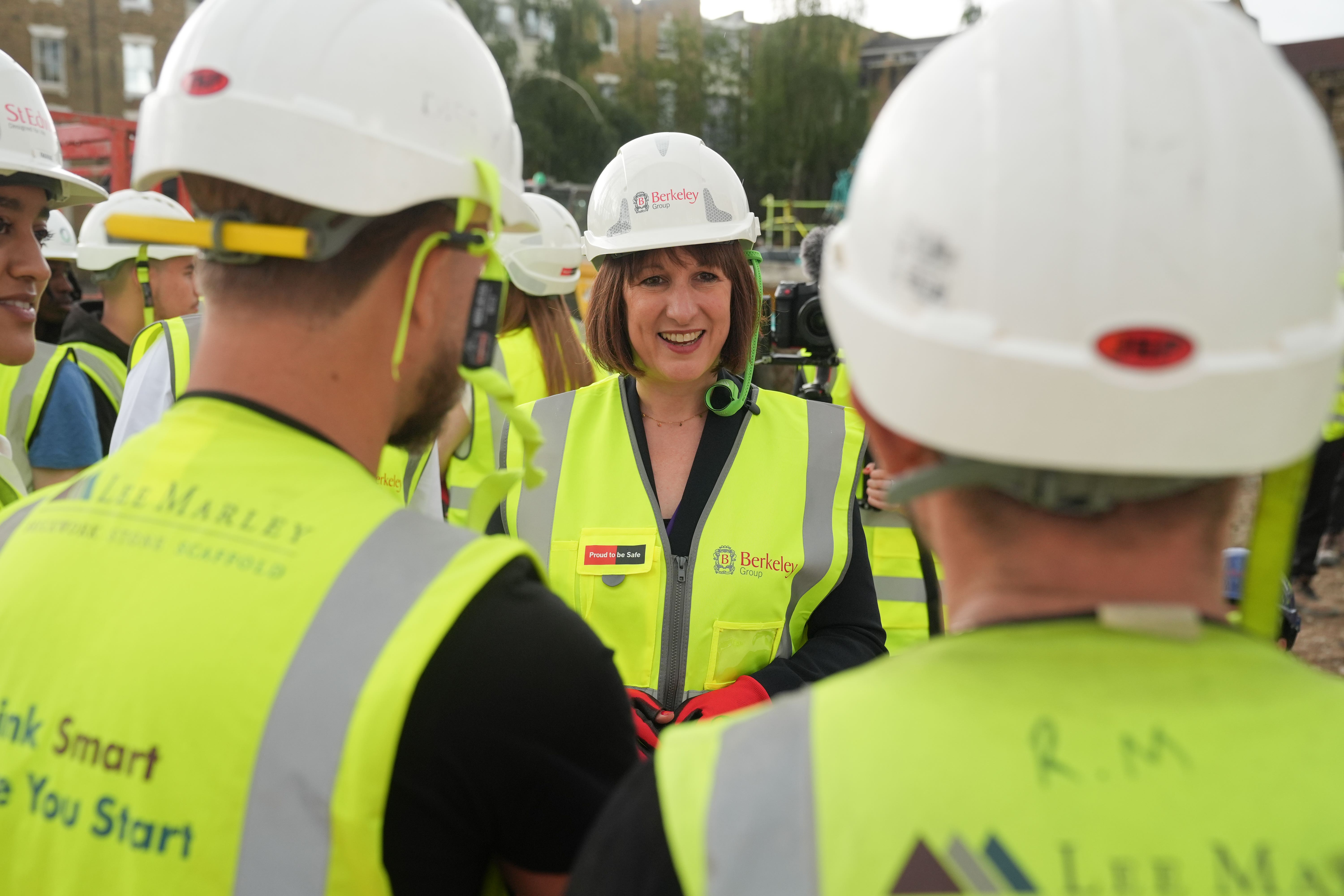 Chancellor Rachel Reeves speaking to apprentices during a visit with Deputy Prime Minister Angela Rayner to the Oval Village project in London (Lucy North/PA)