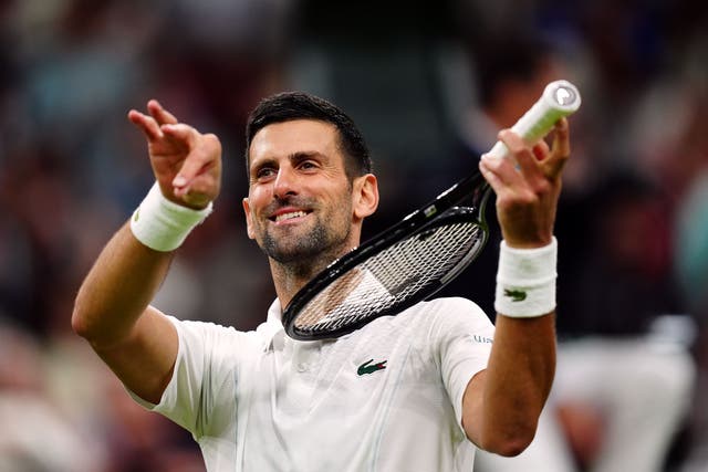 Novak Djokovic pretends to play a violin after beating Holger Rune (Mike Egerton/PA)