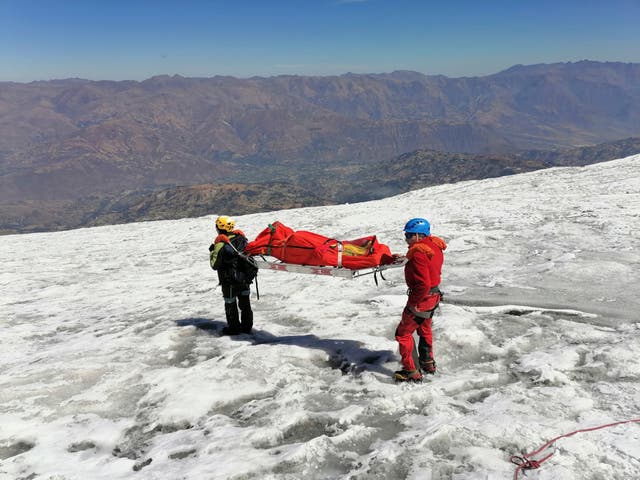 <p>Police retrieve the body of American climber William Stampfl</p>