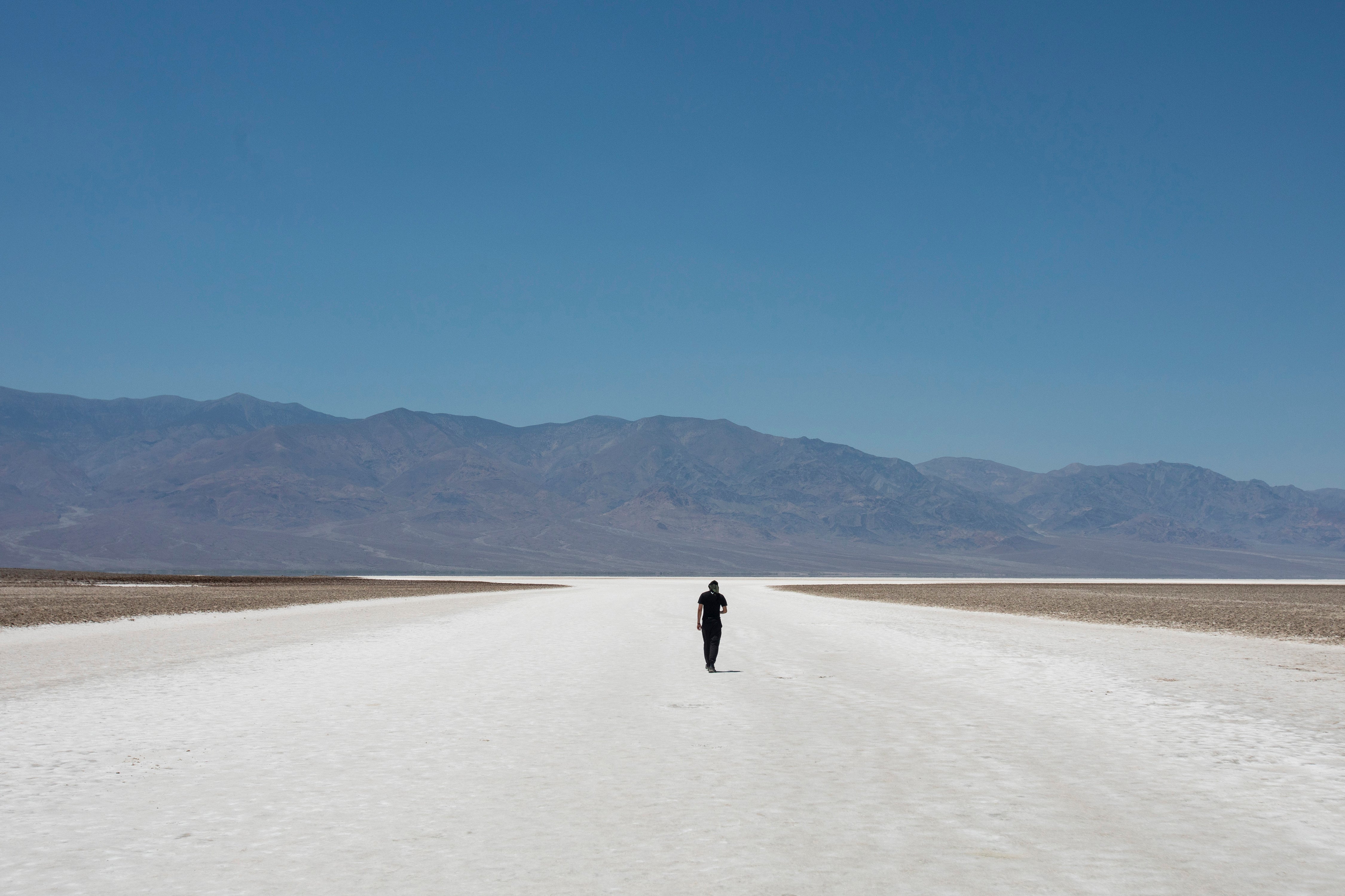 Sheik Mabrouki, of Algeria, walks through Badwater Basin, Monday, July 8, 2024, in Death Valley National Park