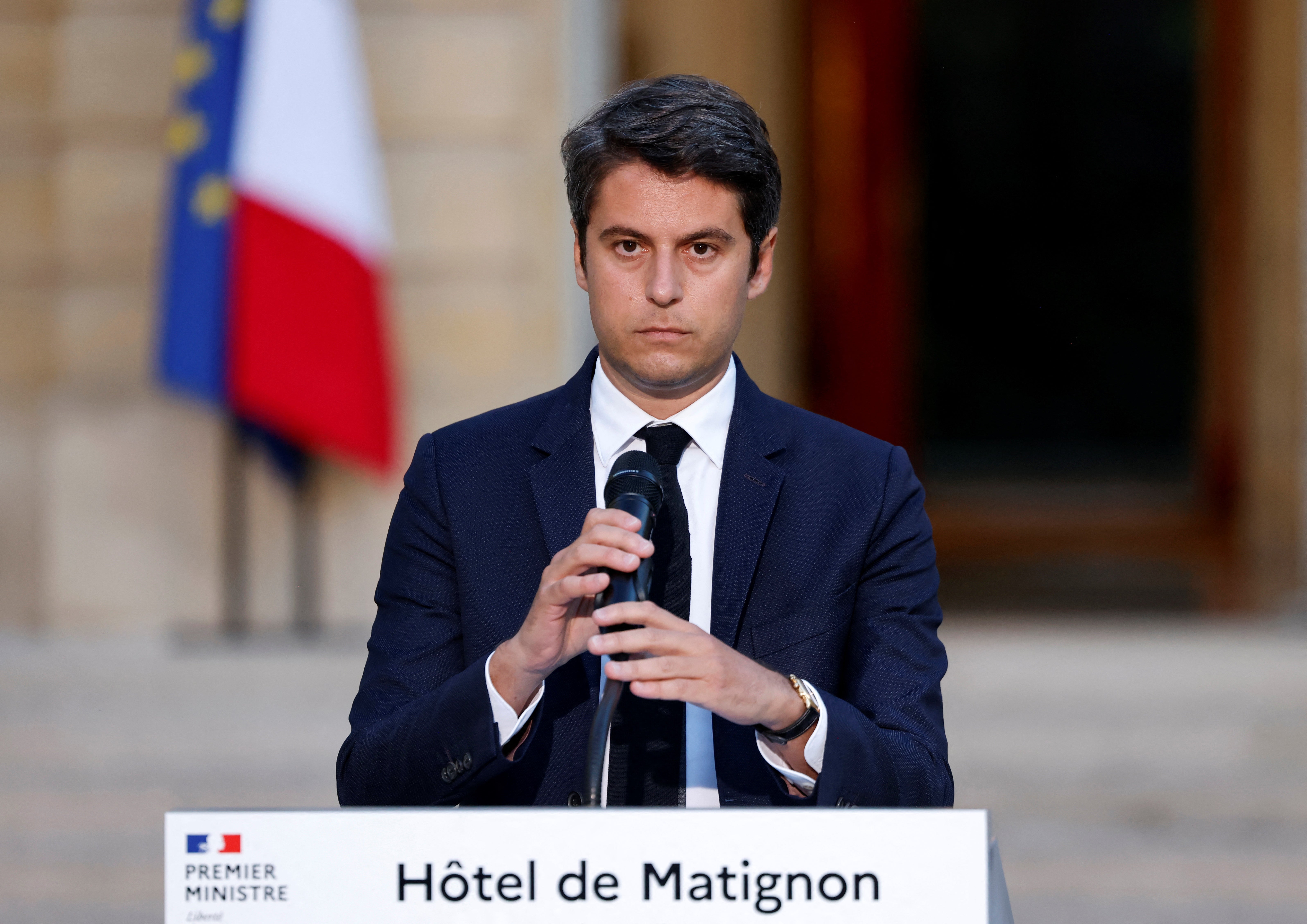 France’s prime minister Gabriel Attal prepares to deliver a speech following the first results of the second round of France’s legislative election at Hotel Matignon in Paris on 7 July 2024