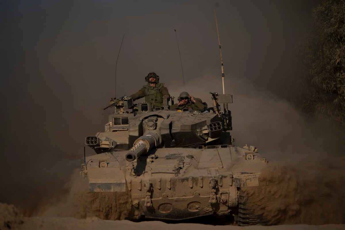 Israeli tanks roll deeper into Gaza City as residents flee
