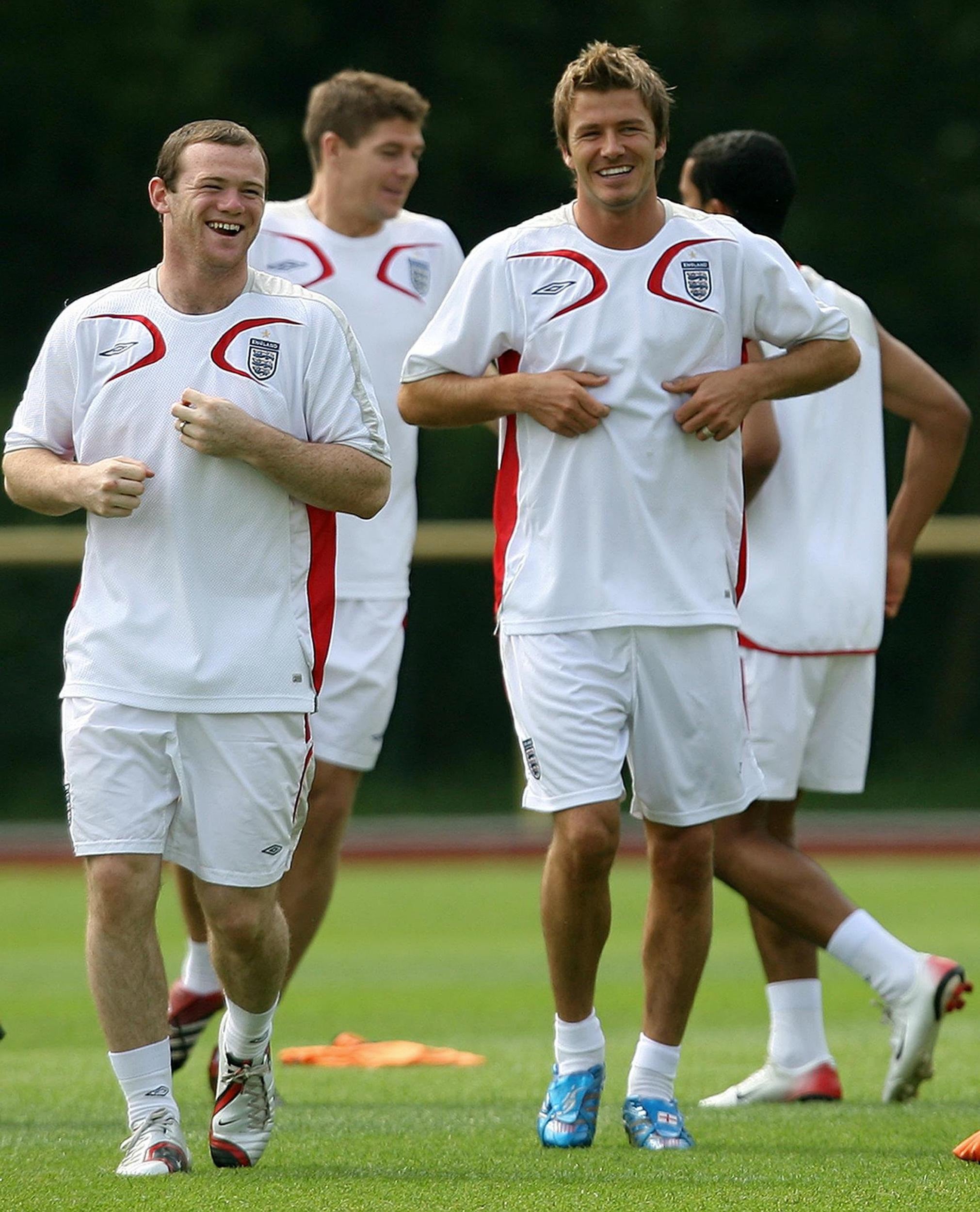 England’s Wayne Rooney (left) and David Beckham during a training session at Mittelbergstadion, Buhlertal, Germany. Picture date: Thursday June 29, 2006. England play Portugal in their Quarter Final match on Saturday. Photo credit should read: Martin Rickett/PA. “This image may only be used in (i) wire services, newspapers, magazines, newspaper or magazine supplements and (ii) any internet version of such newspapers, magazines or supplements, or other editorial internet sites provided that these are not intended for, or promoted as being available for, mobile access/viewing (“Permitted Publications”) and use is subject to the following restrictions: (i) Images may be published for editorial news reporting purposes only.(ii) Images may not be used in association with the names, marks, symbols or logos of any commercial entity.(iii) No alteration (other than, in the case of electronic publication, cropping) or manipulation may be made of (and in the case of electronic publication no text or image may be superimposed over) any published image so as to obscure or remove a sponsor identification image or to add or overlay the commercial identification of any third party which is not officially associated with the FIFA World Cup (other than copyright and photographer credits).(iv) In the case of electronic publication, images must appear as still images (and not as moving images or rapid-sequence streaming or refreshed images eg slideshows). This image may not be used on internet website publications which are viewable by means of mobile tecnology (such as WAP-enabled mobile websites) or transmitted via mobile technology (such as mobile alert services, downloads to mobile devices or MMS messaging). EMPICS will not continue to supply images from the FIFA World Cup to users who do not comply with the restrictions set out above and such failure may result in legal action being brought against users.”