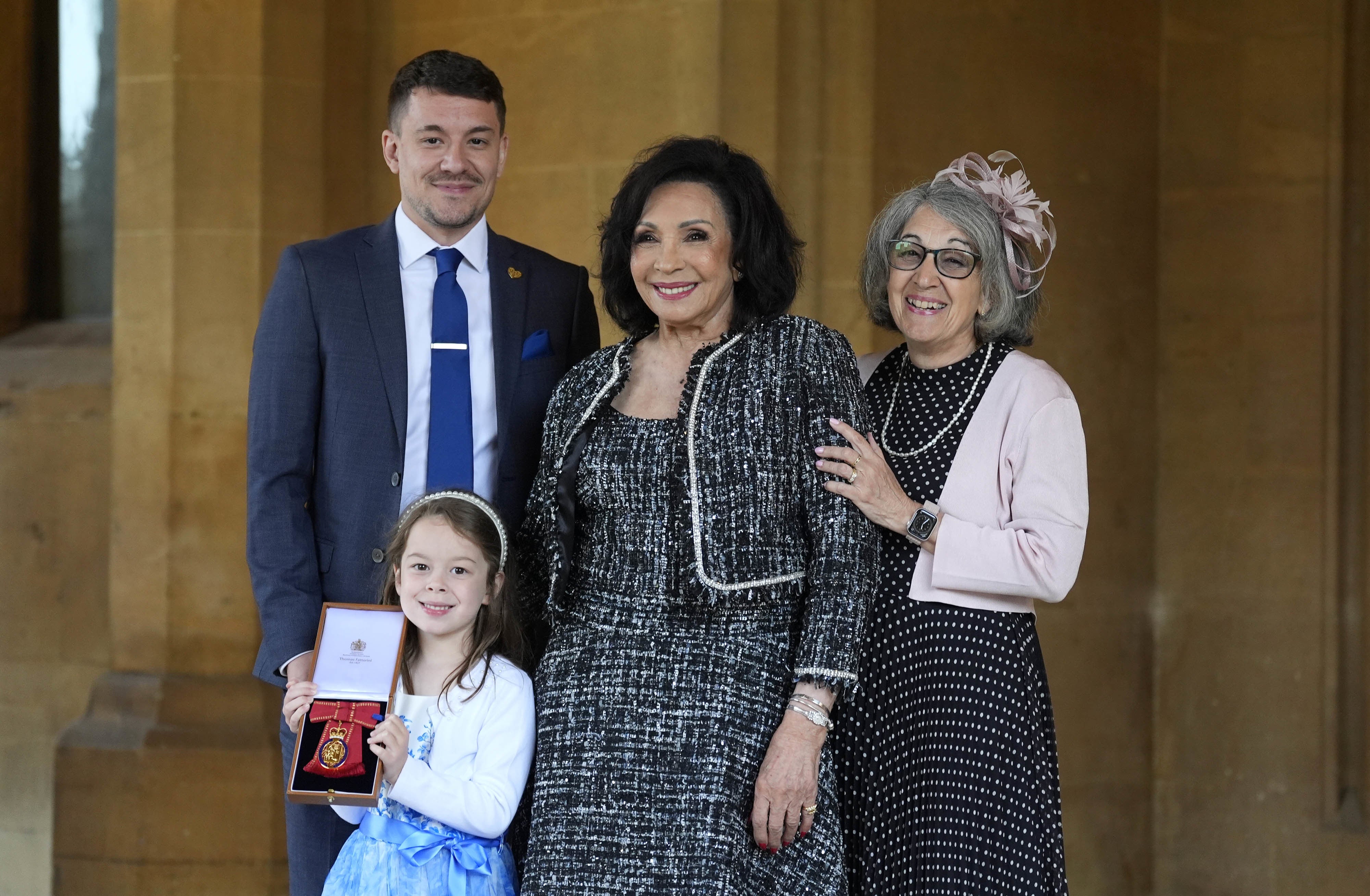 Dame Shirley Bassey, with her daughter Sharon, her grandson Sebastian and his daughter Sofia (Andrew Matthews/PA)