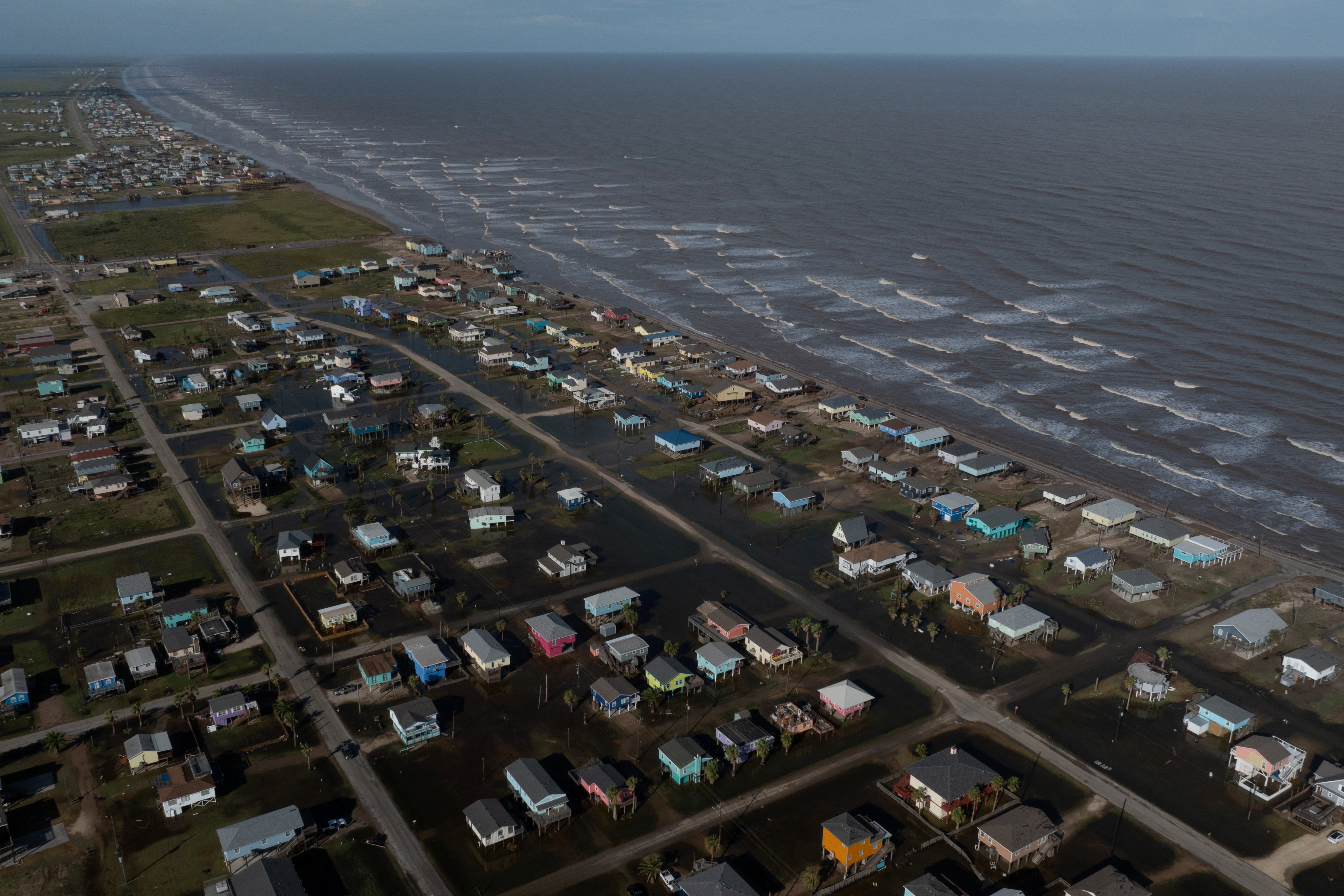 A drone view shows flood waters surrounding homes in the aftermath of Hurricane Beryl in Surfside Beach, Texas, U.S., July 8, 2024