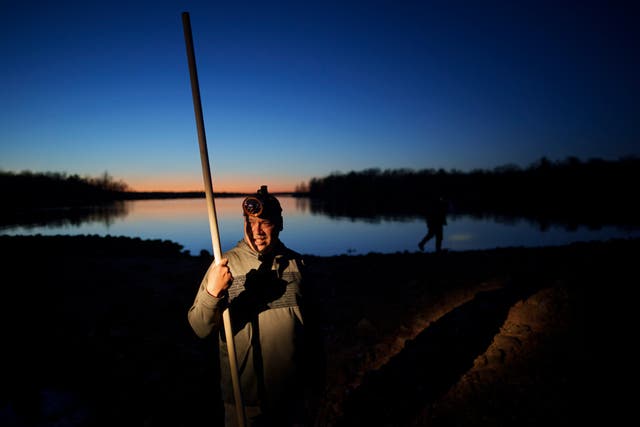 <p>John Baker holds a spear while getting ready for a night of fishing at the Chippewa Flowage on the Lac Courte Oreilles Reservation, Sunday, April 14, 2024, near Hayward, Wis. Spearfishing is a traditional Ojibwe method of harvesting fish such as walleye in the spring when the fish venture to shallow waters in the evening to spawn. (AP Photo/John Locher)</p>