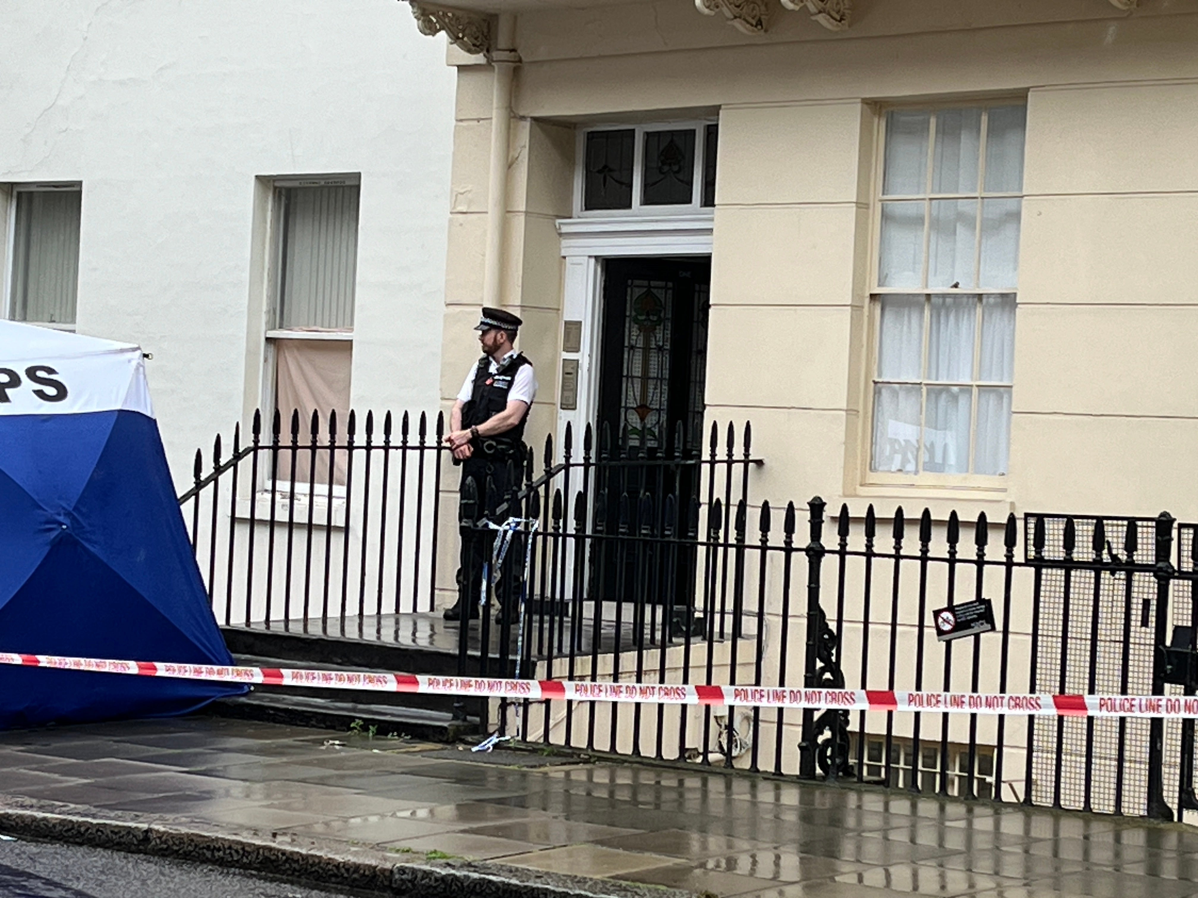 Police officer guards the scene after a baby was found dead