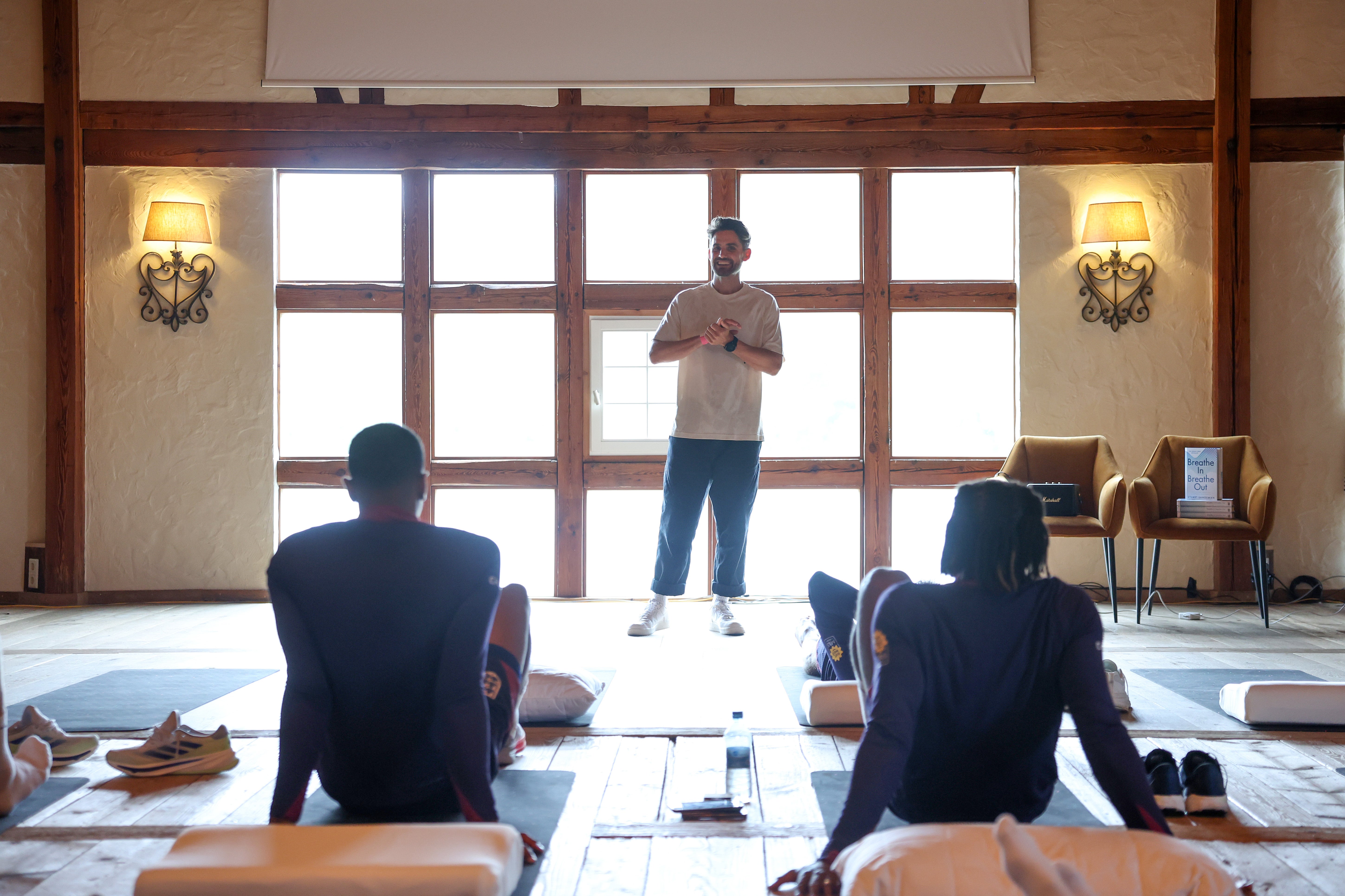 <p>Stuart Sandeman conducts a breathwork recovery session with the England squad at Spa & Golf Resort Weimarer </p>