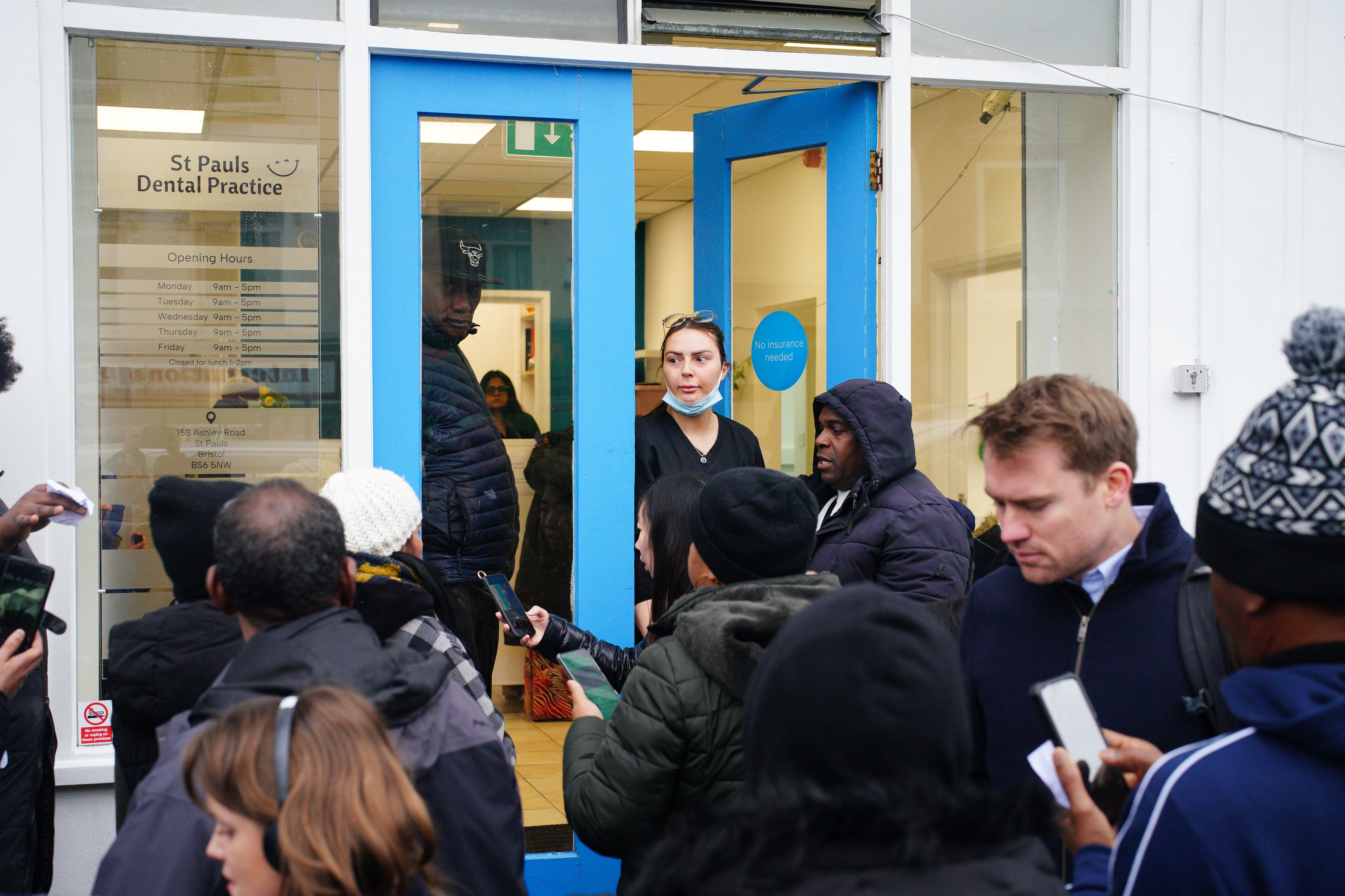 Huge queues of people waiting outside St Paul's dental practice in Bristol (Ben Birchall/ PA)