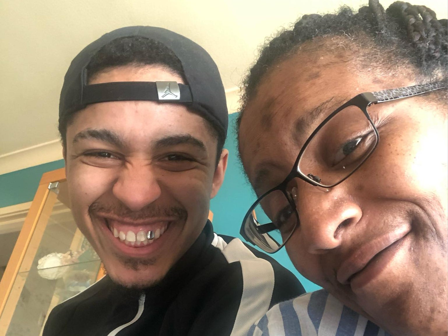 Ricardo smiles with his mother