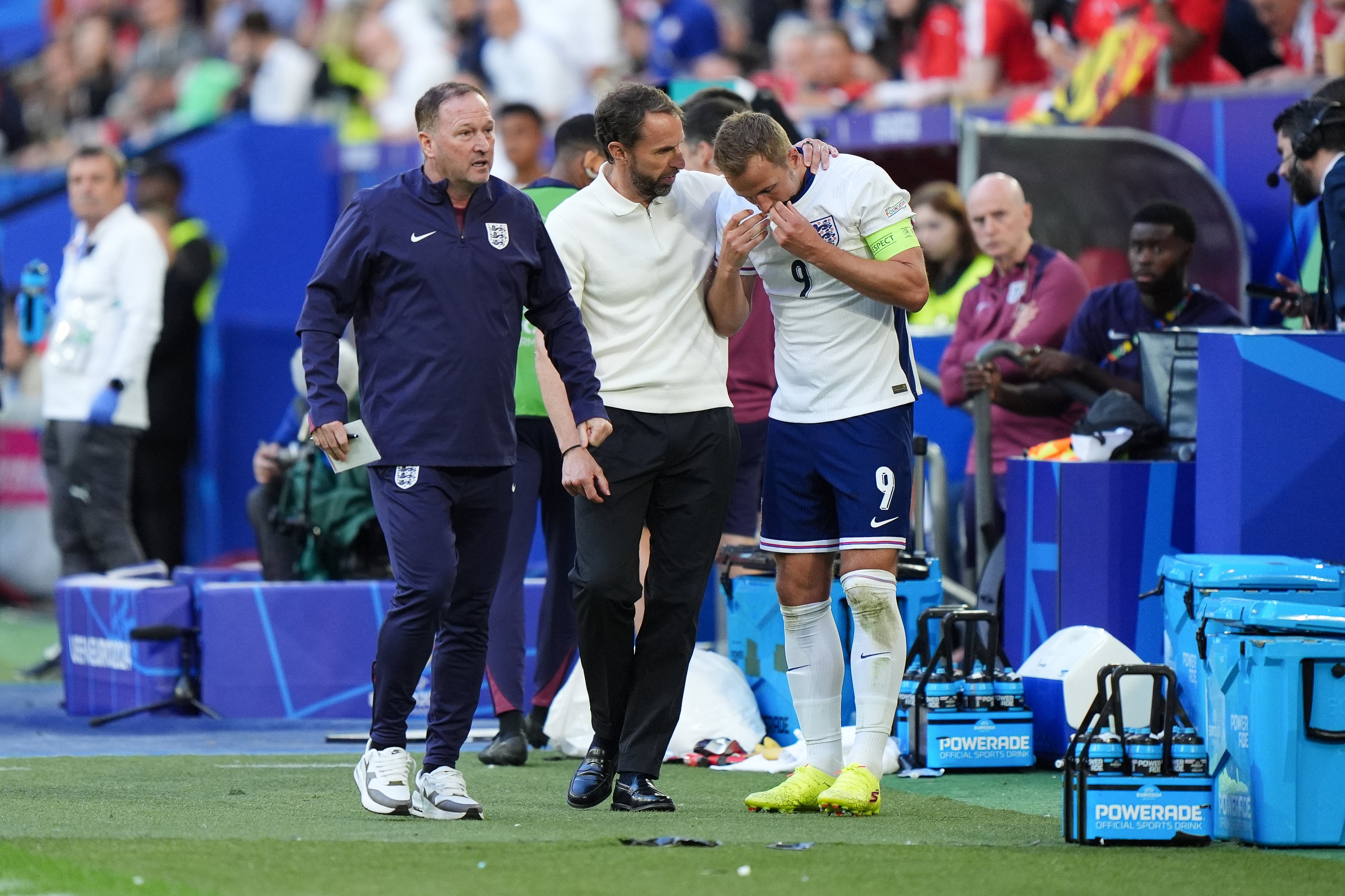 Harry Kane, right, struggled with cramp against Switzerland (Bradley Collyer/PA)