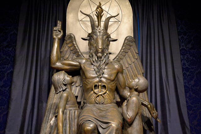<p>The Baphomet statue is seen in the conversion room at the Satanic Temple where a ‘Hell House' is being held in Salem, Massachusett on October 8, 2019</p>