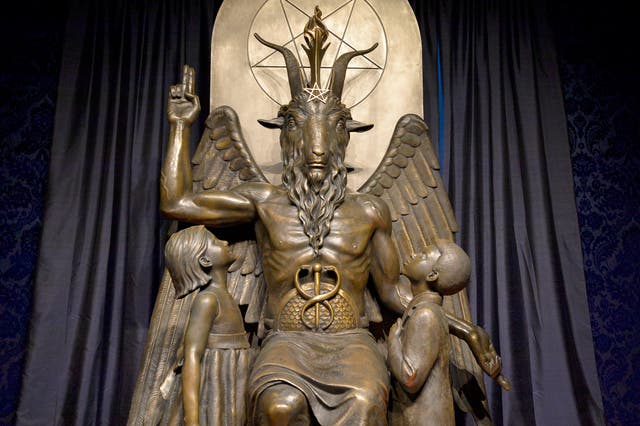 <p>The Baphomet statue is seen in the conversion room at the Satanic Temple where a ‘Hell House' is being held in Salem, Massachusett on October 8, 2019</p>