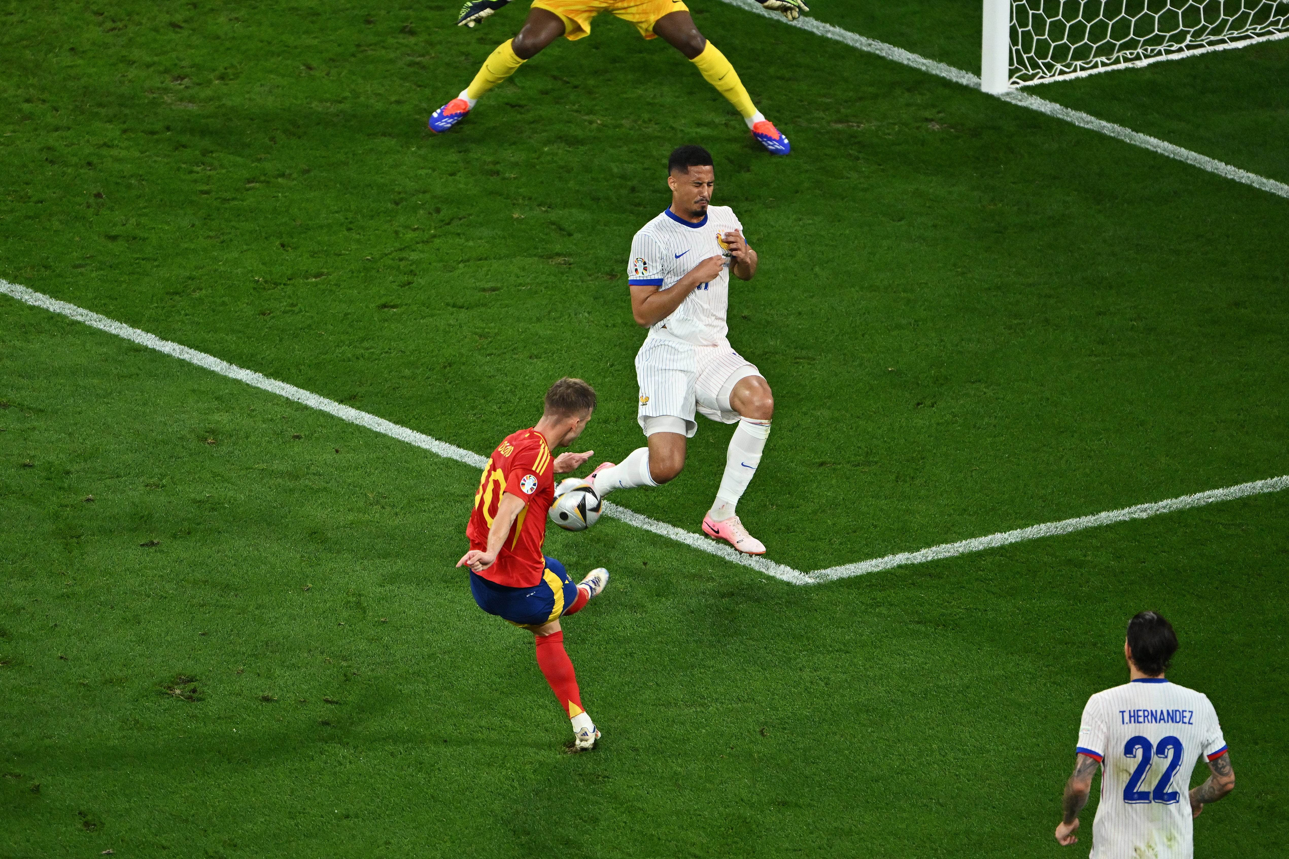 William Saliba is unable to block Olmo’s shot, which deflects in off Jules Kounde as Spain take the lead