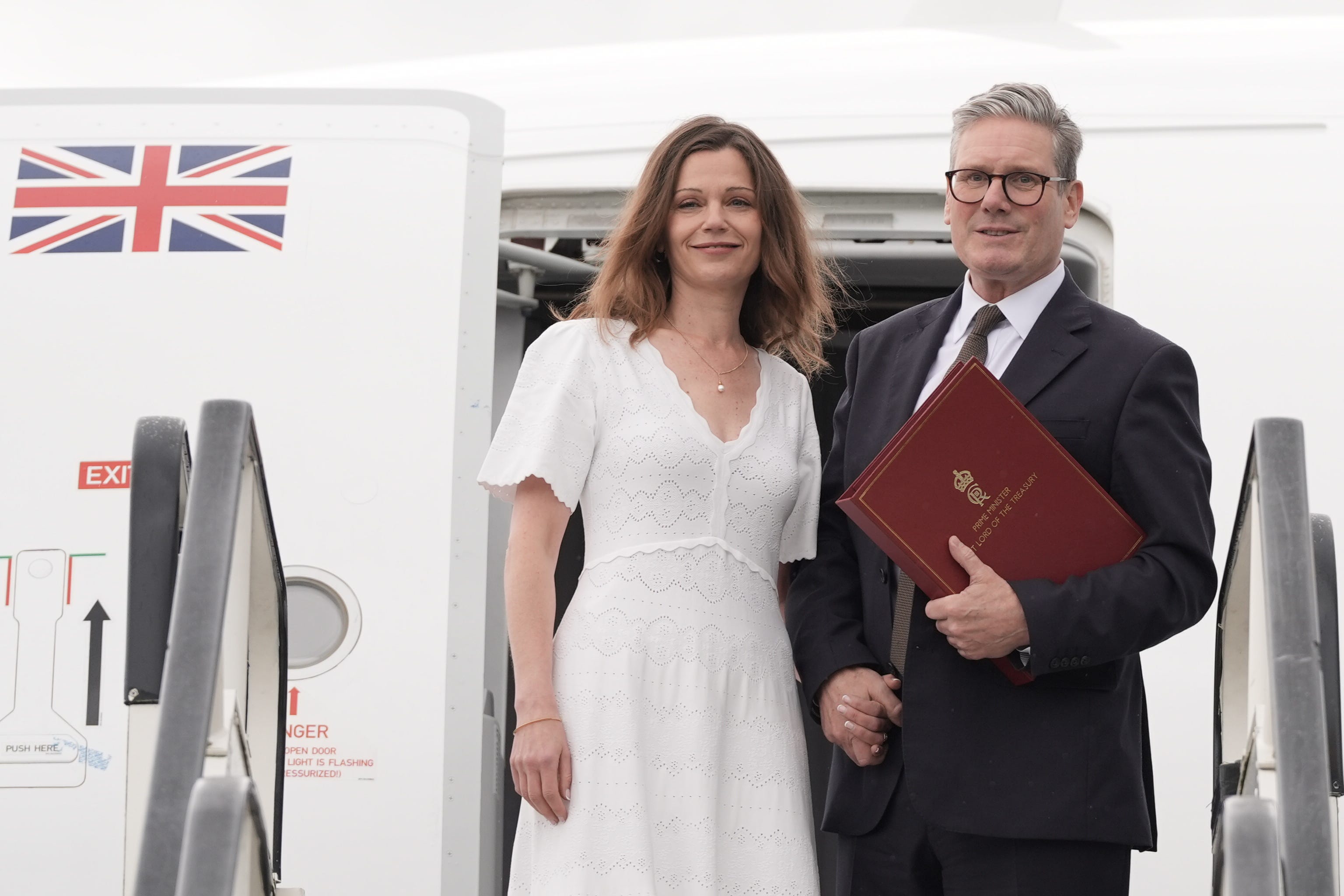 Prime Minister Sir Keir Starmer and his wife Victoria board a plane (Stefan Rousseau/PA)