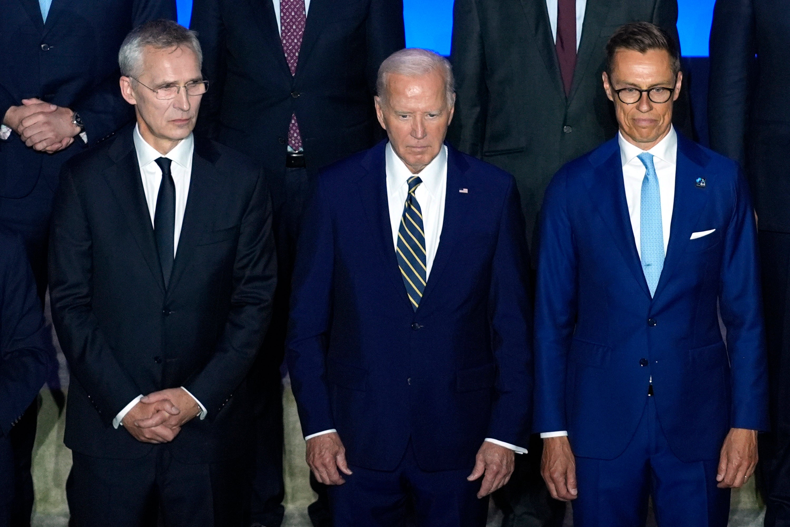 President Joe Biden, center, poses with NATO Secretary General Jens Stoltenberg, left, and Finnish President Alexander Stubb before delivering remarks on the 75th anniversary of NATO at the Andrew W. Mellon Auditorium on July 9