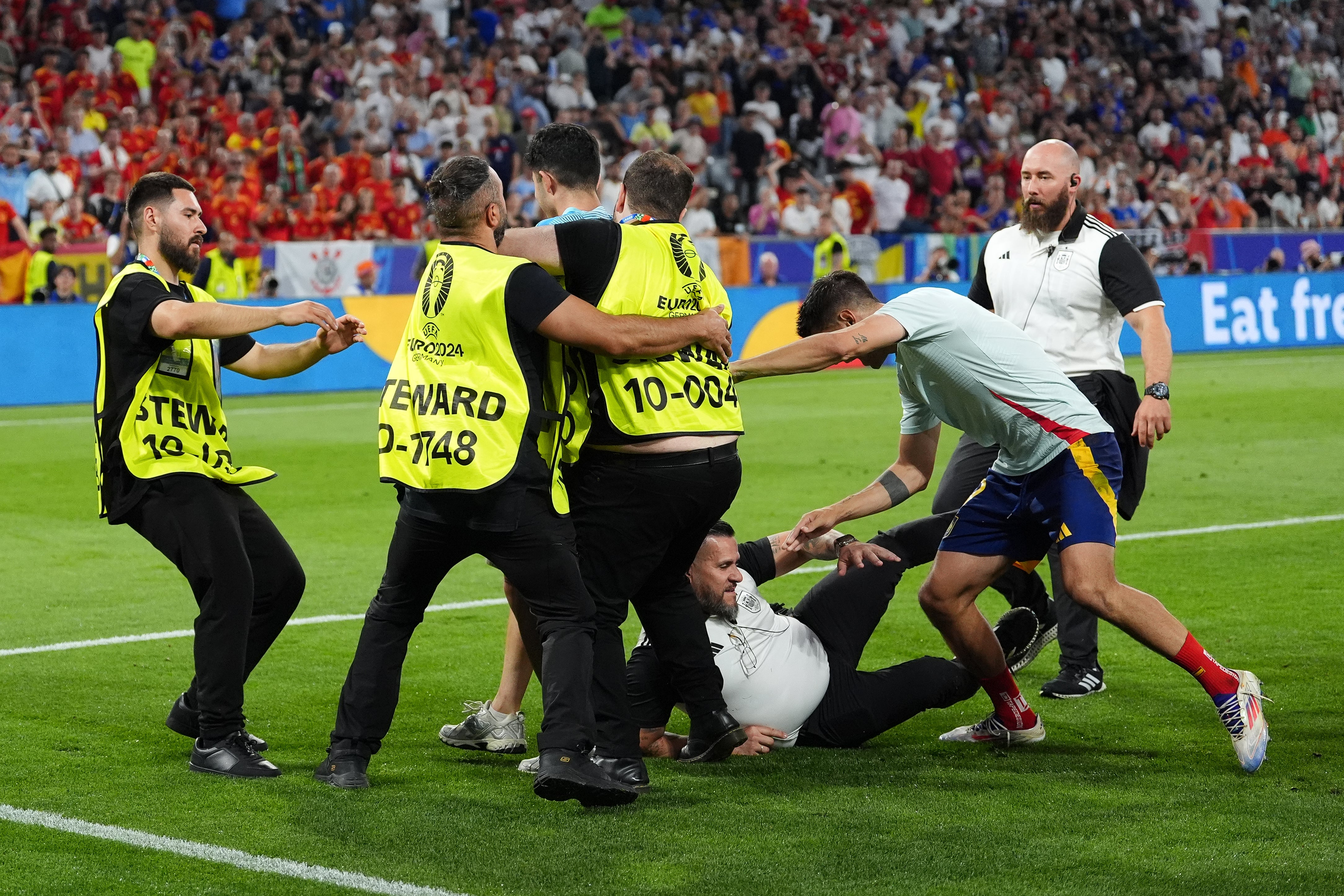 A security guard slips and injures Spain’s Alvaro Morata, second right (Bradley Collyer/PA)