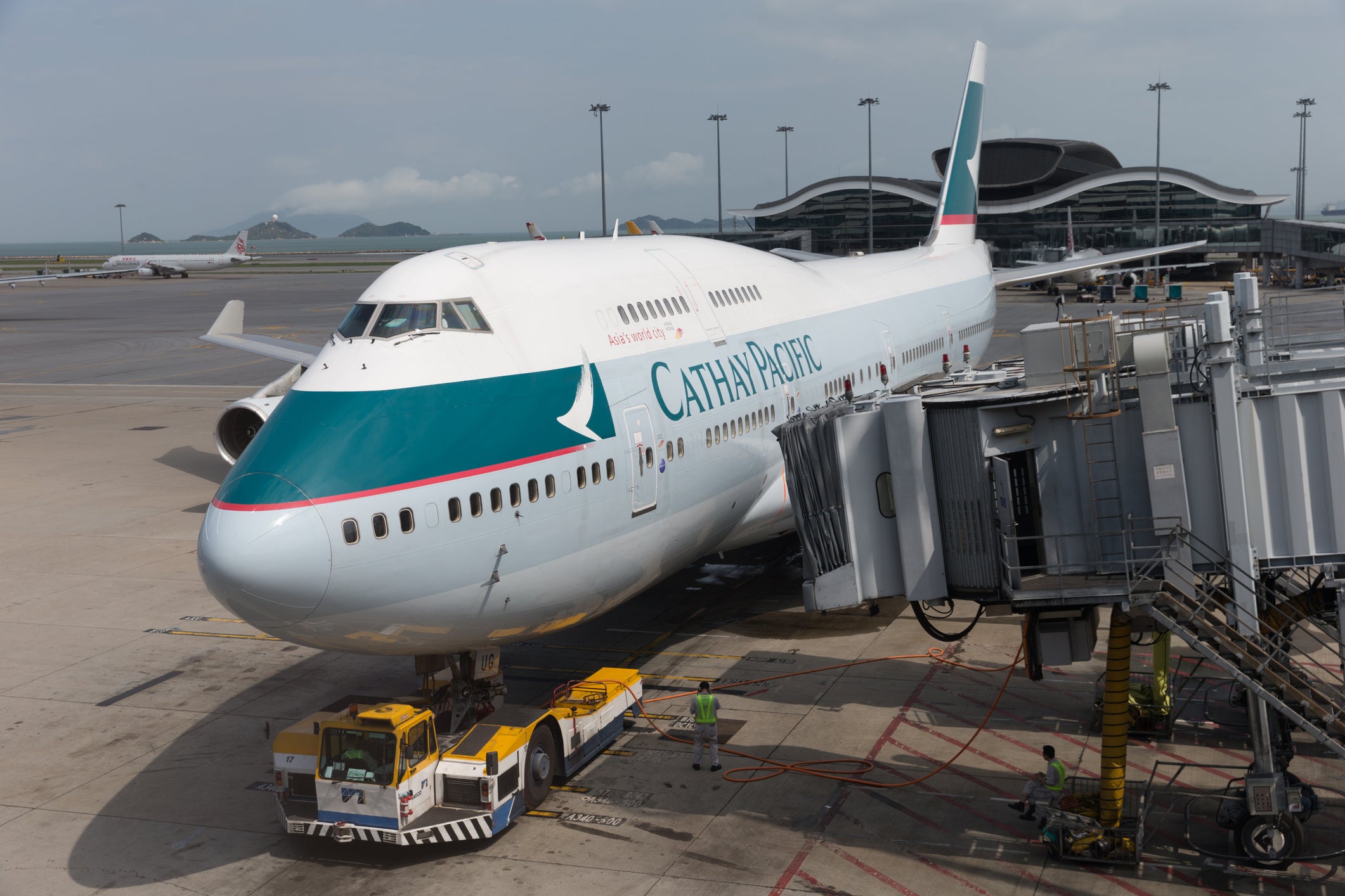 A Cathay Pacific Airways plane at Hong Kong International Airport (stock image). A flight attendant was forced to hold a bathroom door during a 16-hour flight from Hong Kong to New York City this week