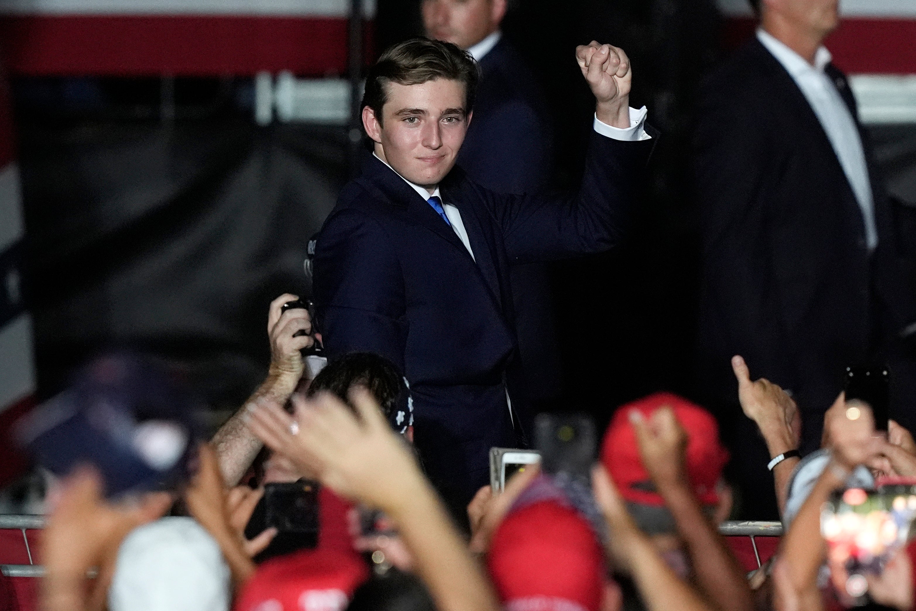 Barron Trump raised a fist to the cheering Florida audience in his first rally appearance