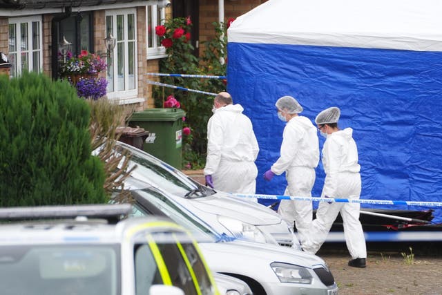 Forensic officers at the scene in Ashlyn Close, Bushey, Hertfordshire. (James Manning/PA)