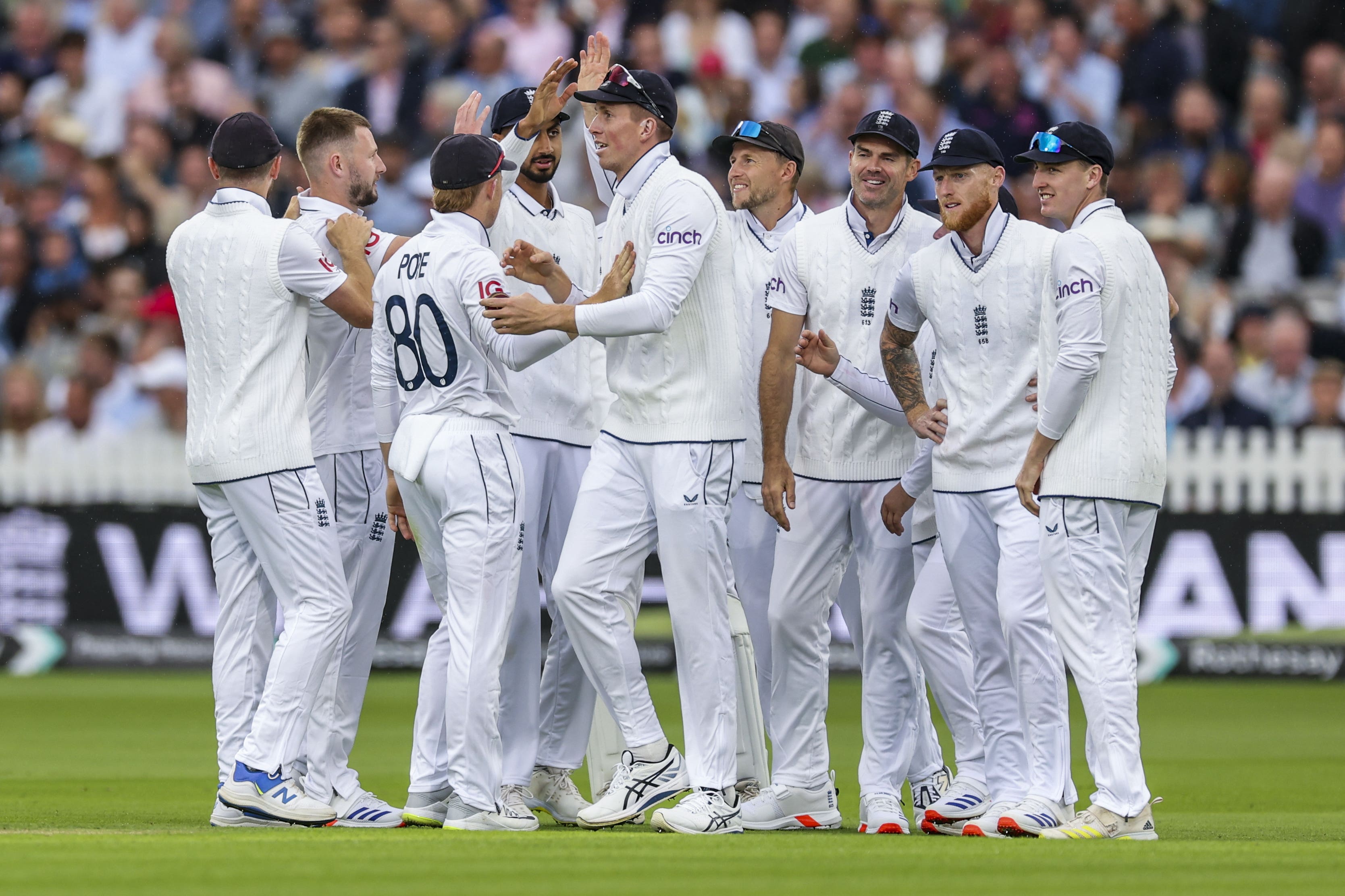 Gus Atkinson (second left) celebrates with England team-mates after taking the wicket of West Indies’ Kirk Mckenzie (Steven Paston/PA)