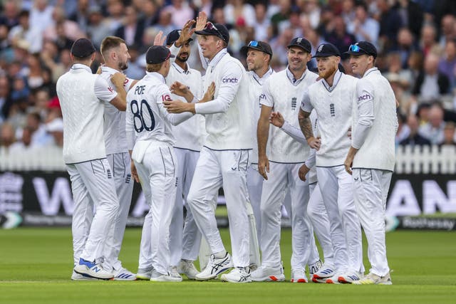 Gus Atkinson (second left) celebrates with England team-mates after taking the wicket of West Indies’ Kirk Mckenzie (Steven Paston/PA)