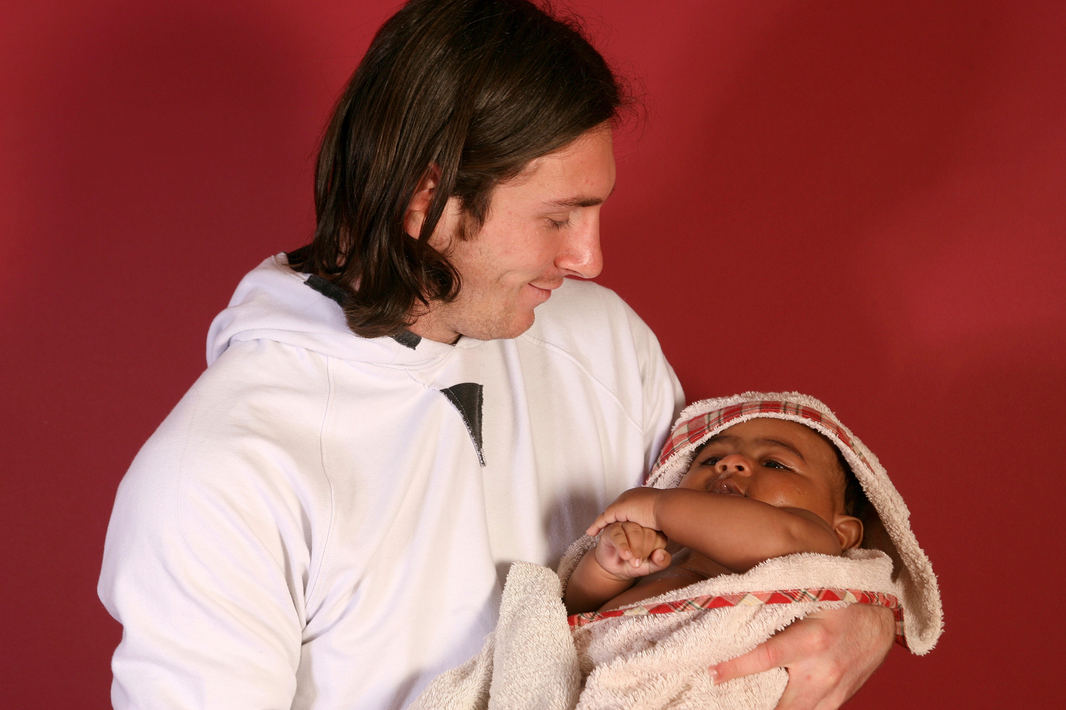 Lamine Yamal cradled by Lionel Messi