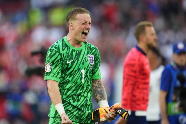 England goalkeeper Jordan Pickford celebrates after the penalty shoot-out win over Switzerland (Adam Davy/PA)
